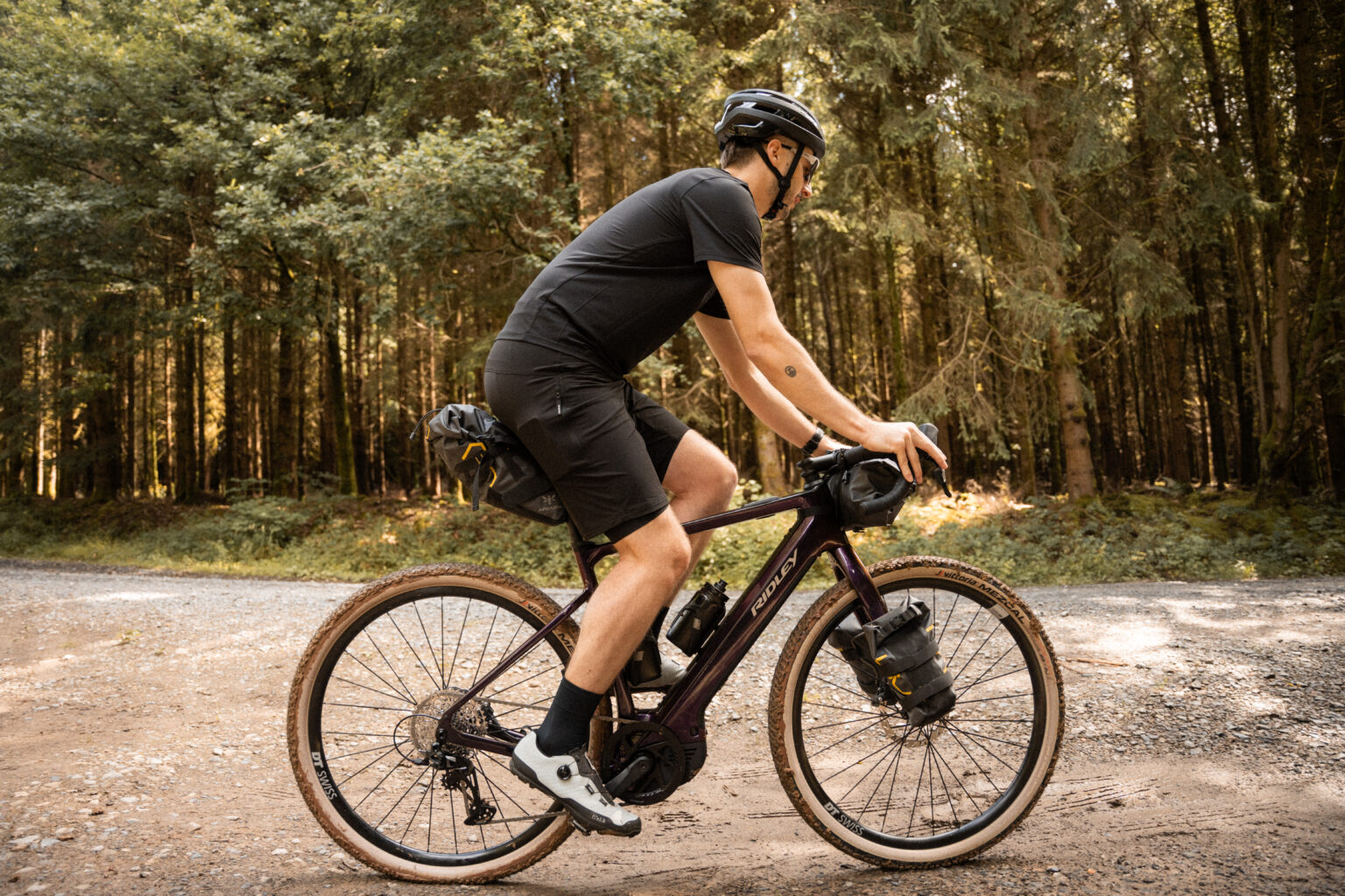 a man riding with Ridley E-Kanzo with bikepacking gear attached