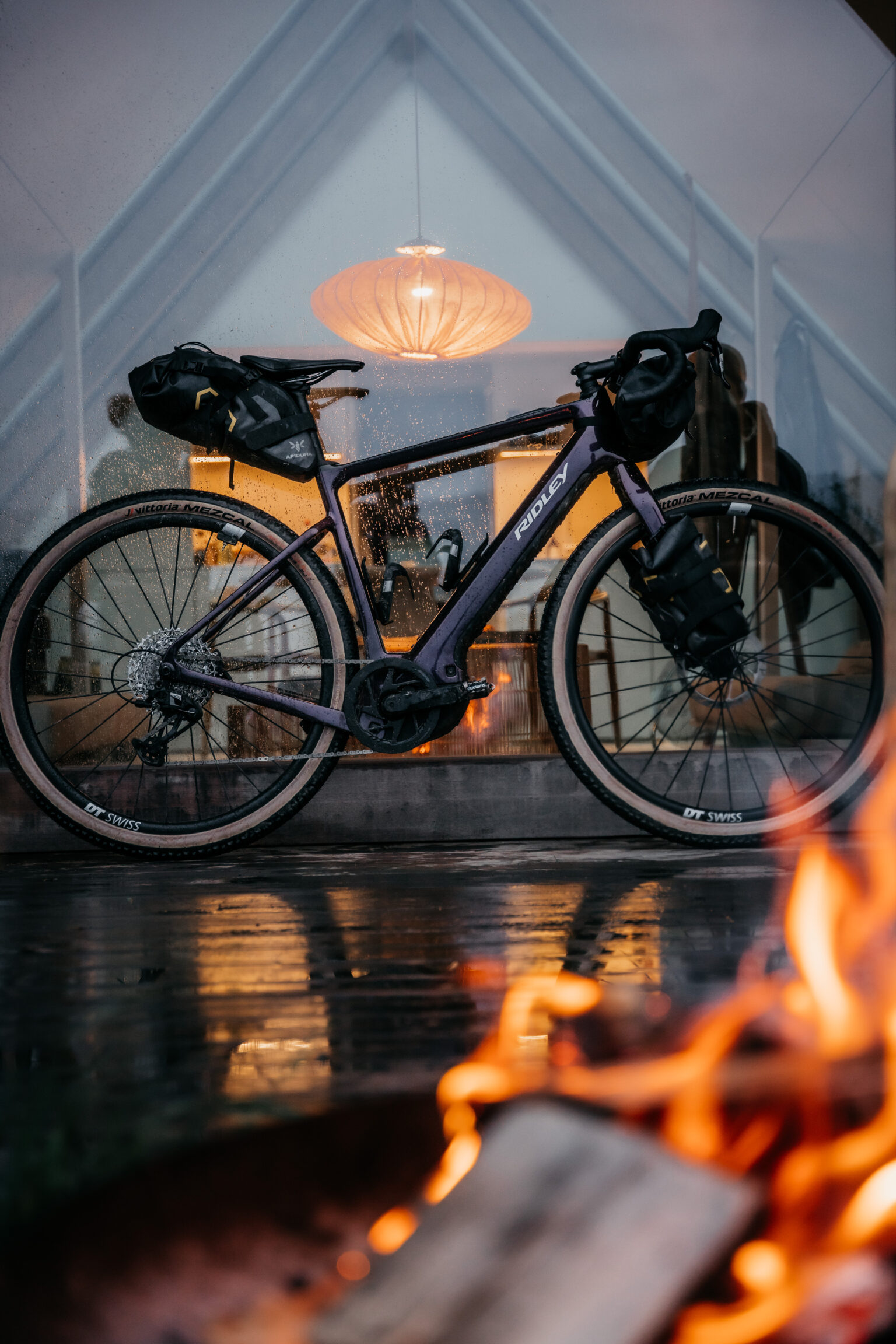 the E-Kanzo Adventure packed in front of a flame