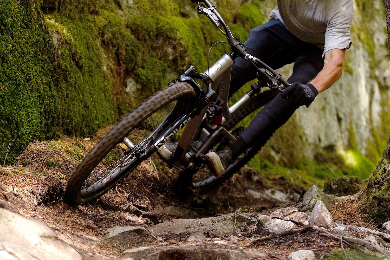 A rider using the Reserve wheels with e13 hubs on a rocky trail.