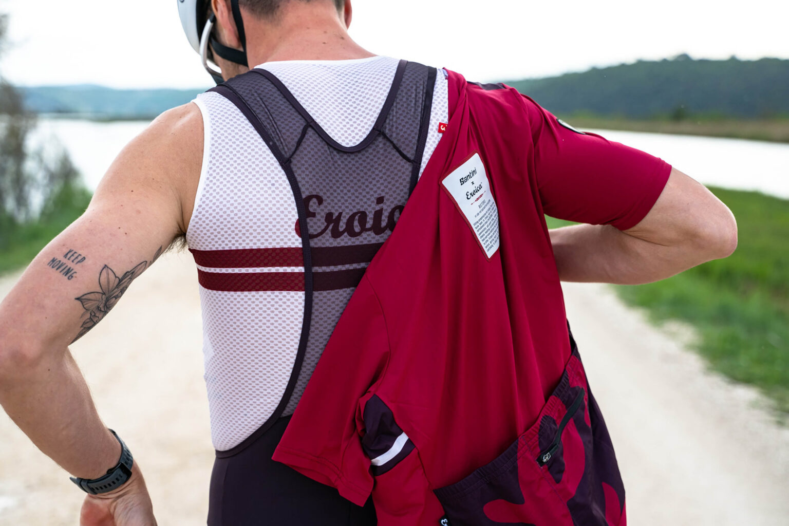 putting on a santini x eroica jersey over santini riding bibs