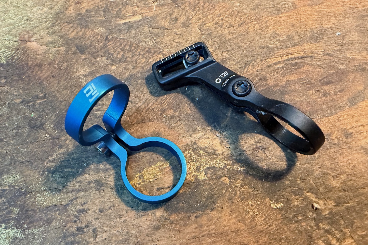 comparison photo of the 90 degree pod clamp vs the stock matchmaker clamp.