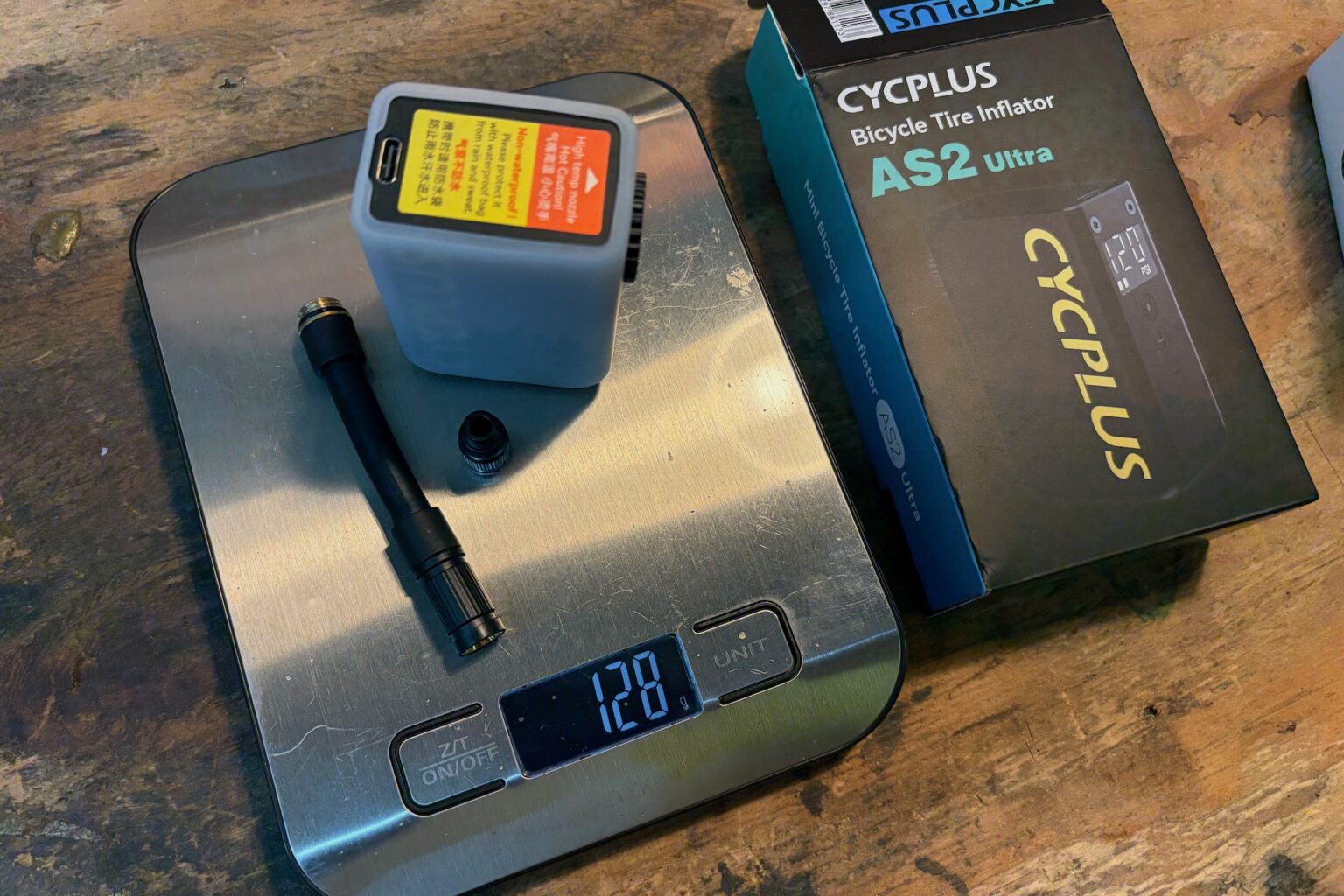 the AS2 Ultra on a scale with the cover, hose, and presta head