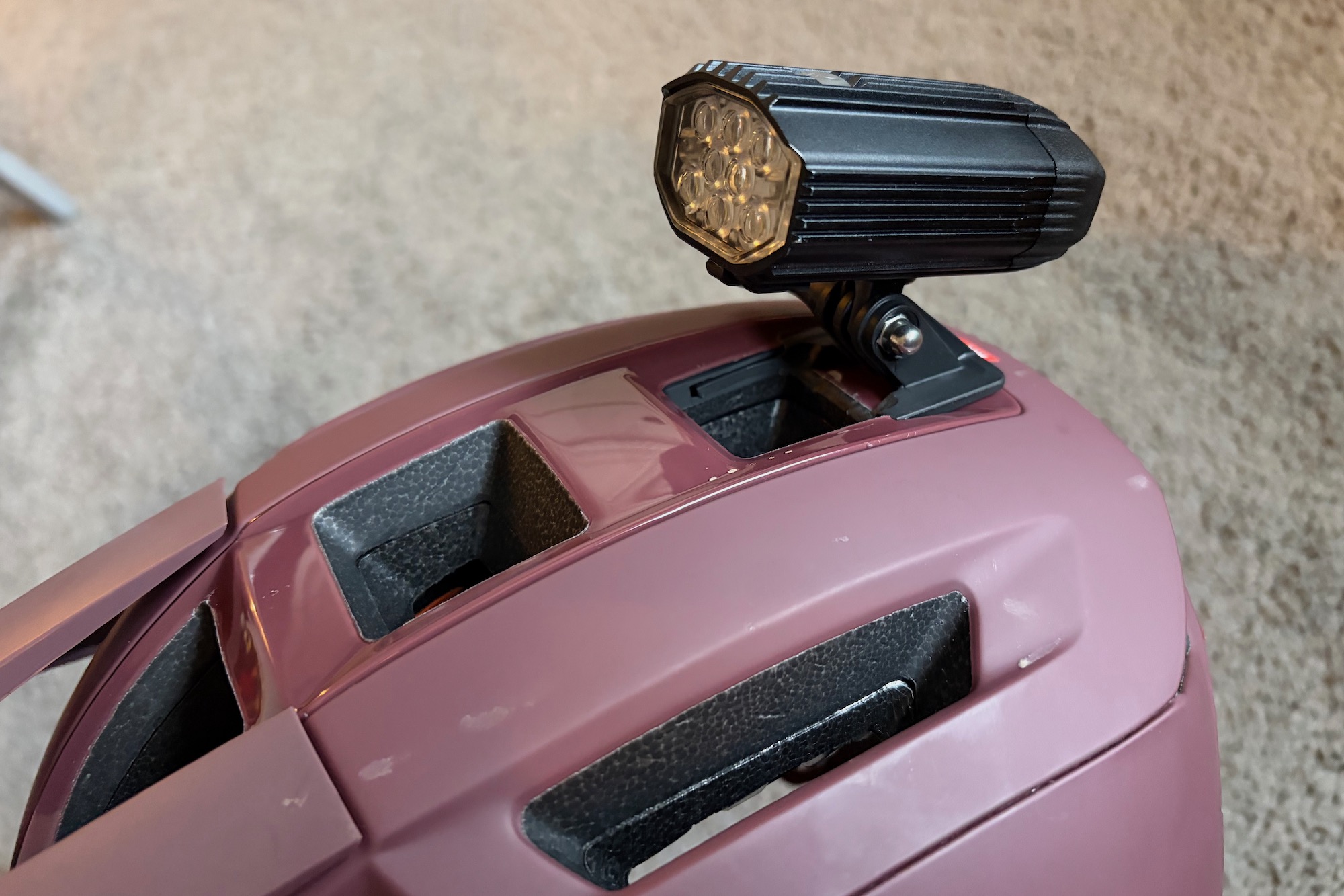 A Lezyne helmet light attached to the universal mount on the Impala KinetiCore helmet. 