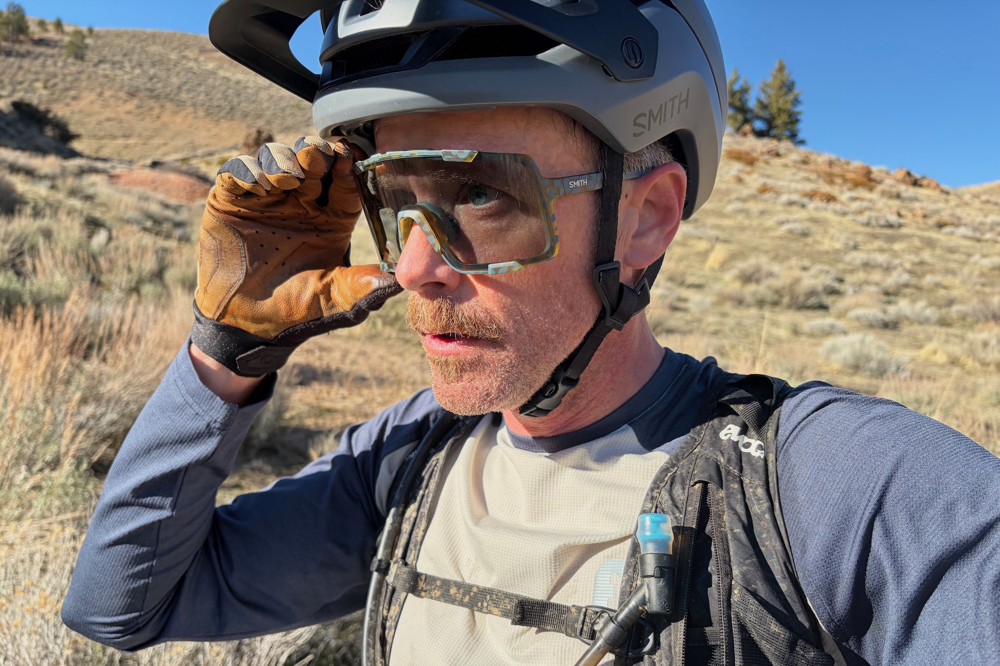 adjusting the smith syncline glasses while out on a bike ride.