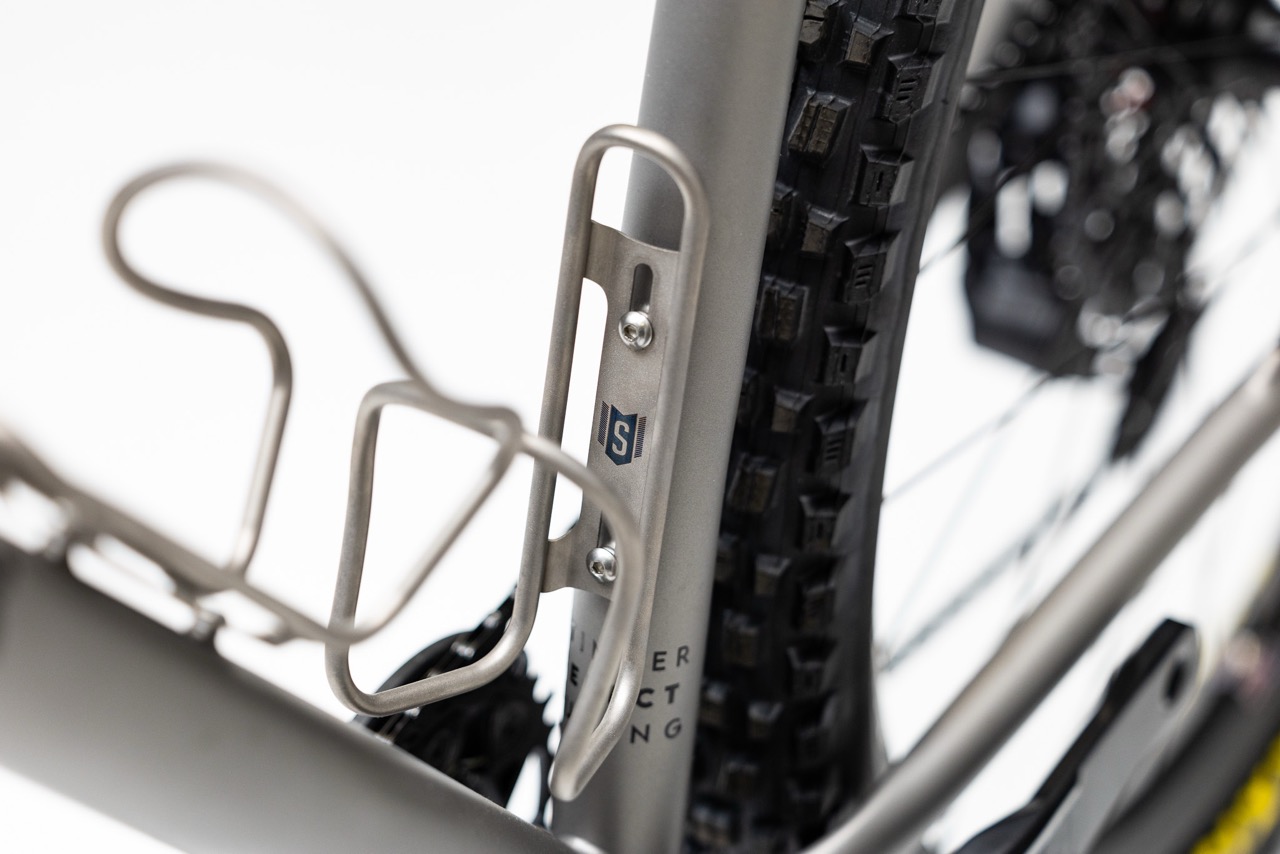Stinner Frame Works Ti Cages and Photo Stick 2.0 on seat tube