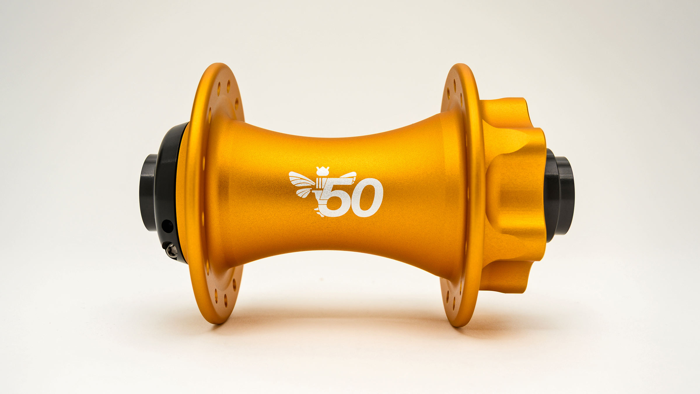 2026 Chris King 50th anniversary celebrated in limited Matte Gold honey sweetness, front hub bee logo detail