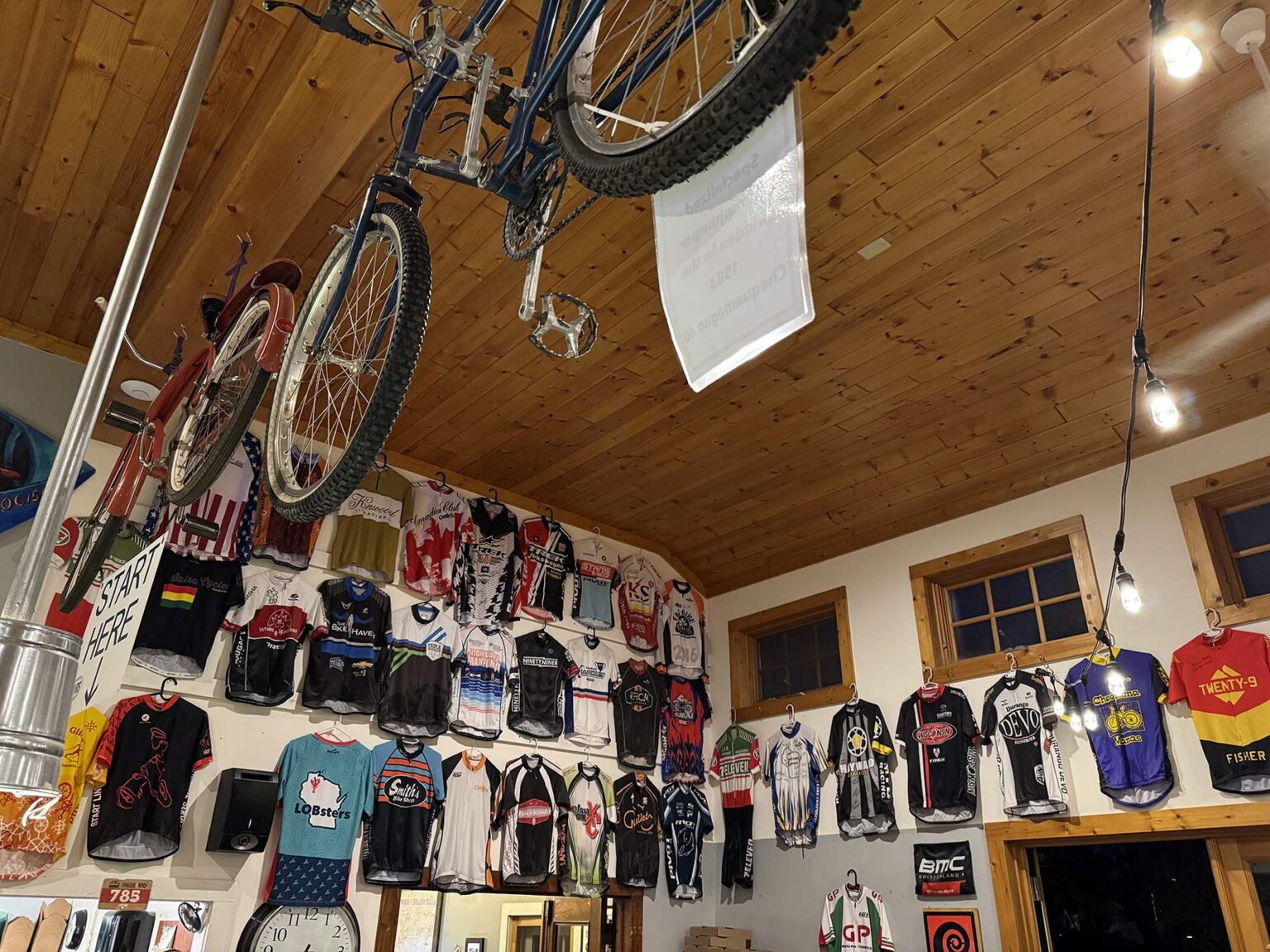 cycling jerseys on the wall at rivers eatery pizzeria.
