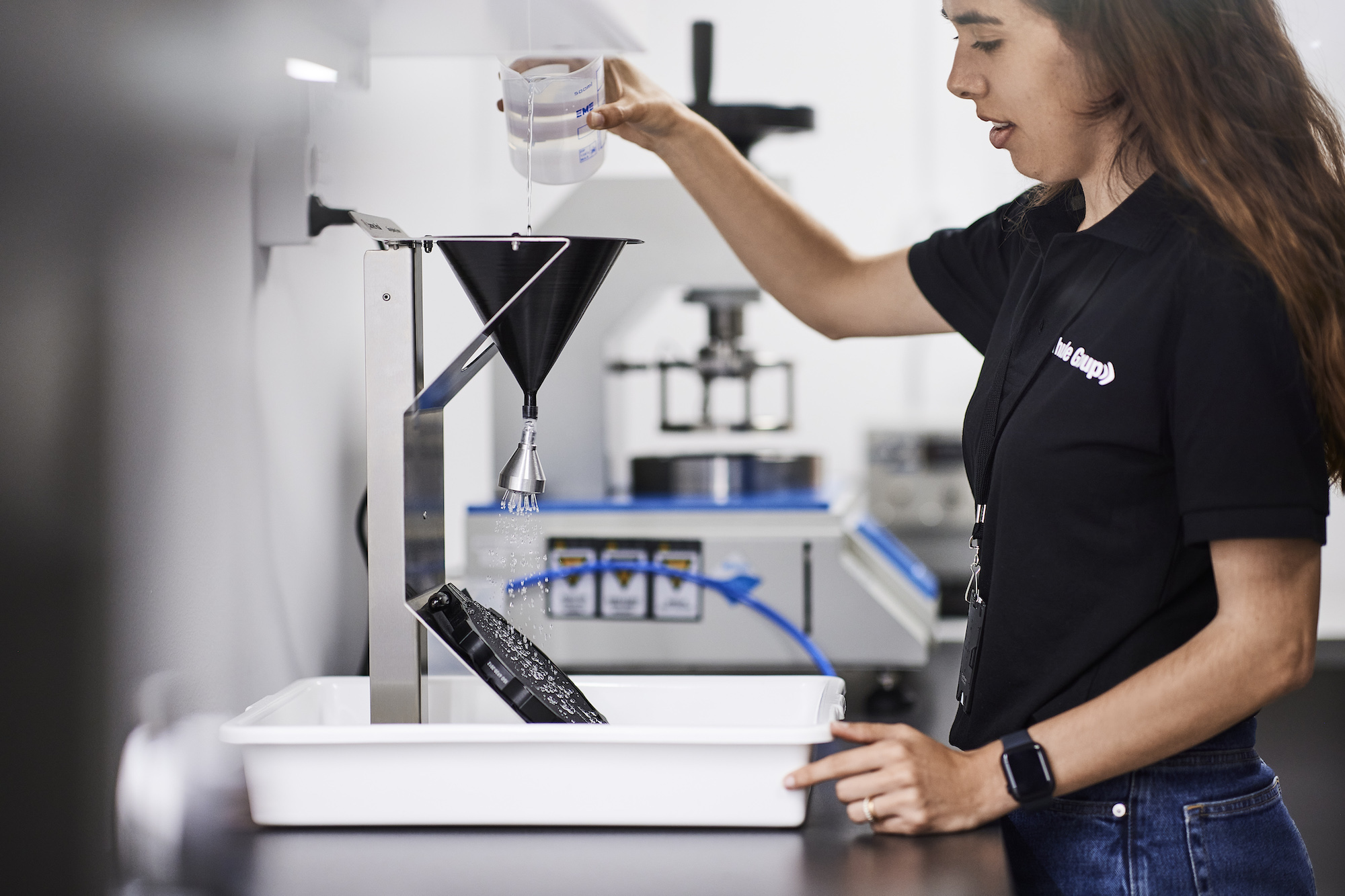 a Thule engineer performing a test on a part at the Thule Hillerstorp facility.