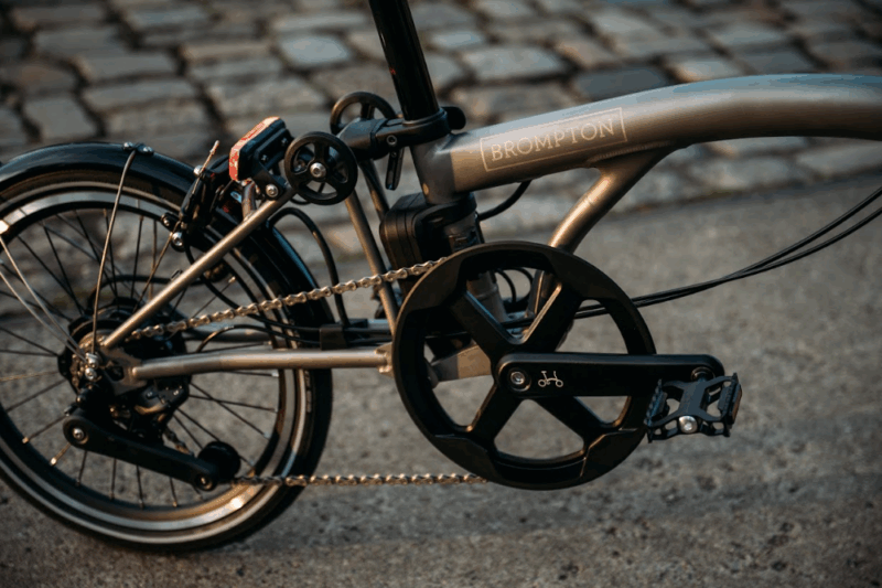 Brompton Revamps Their Electric Lineup, Including Their Lightest Titanium Folding E-Bike Ever