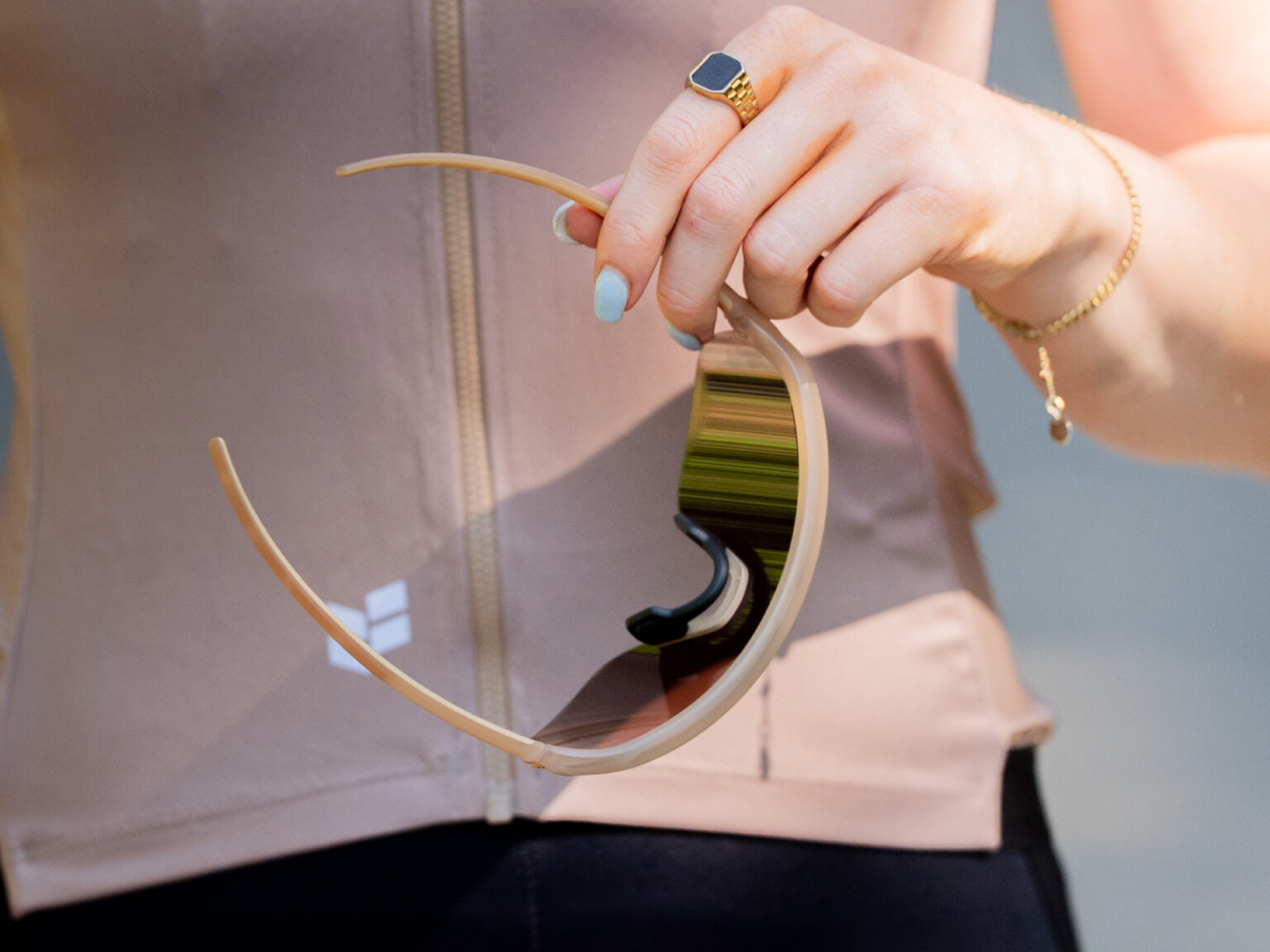 holding the new Arc FLUX glasses