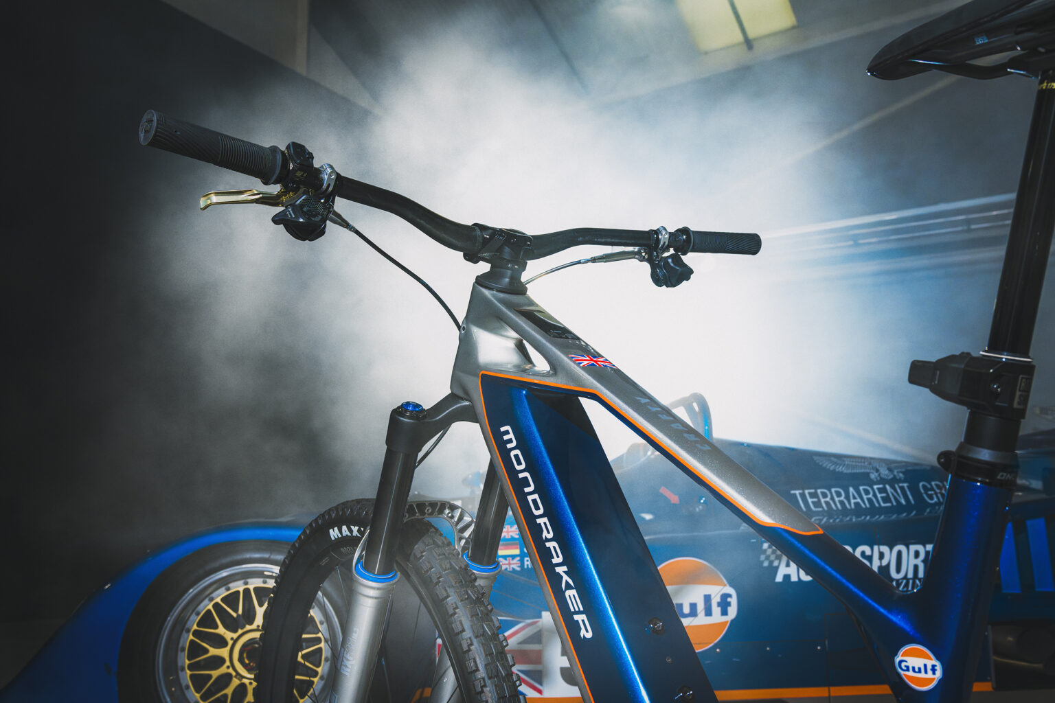 A close up of the new Crafty with a race care in the background