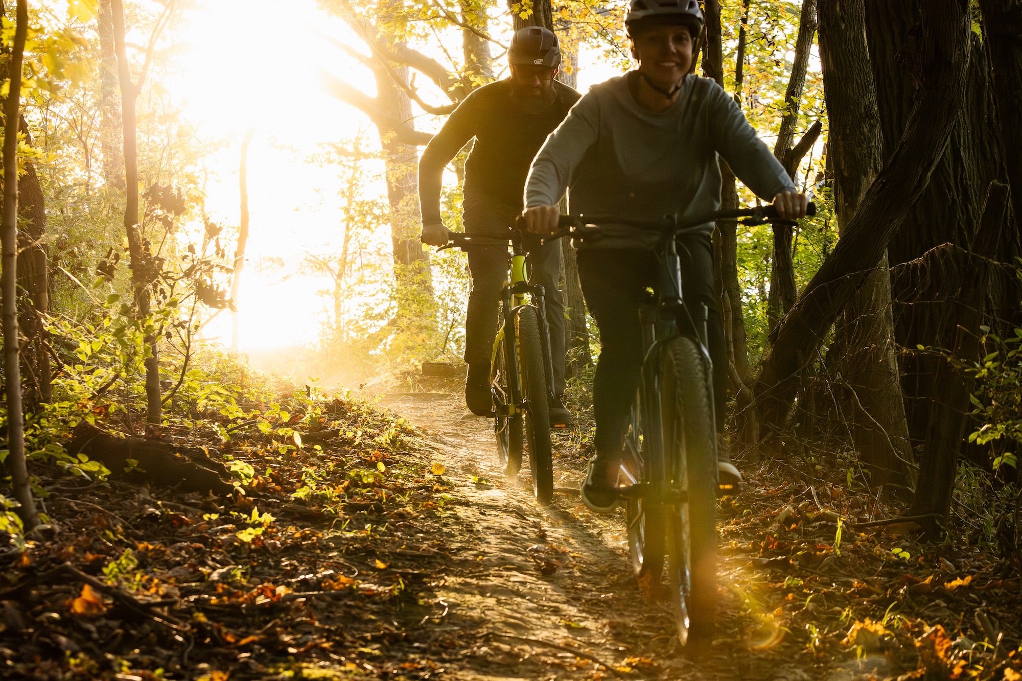 two riders on the Batch MB.1 and MB.2 hardtails riding down a mountain bike trail.