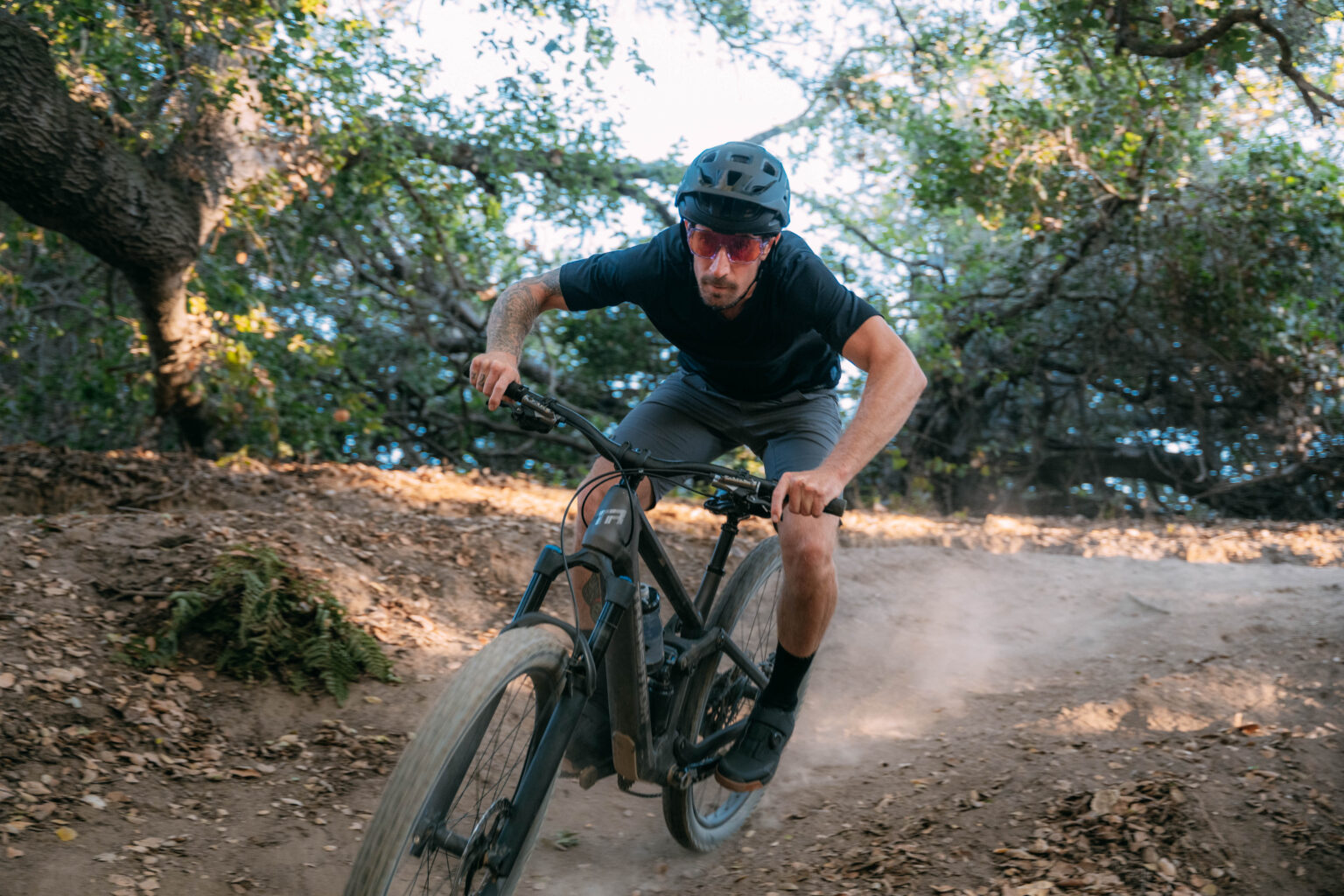 a mountain biker riding with the Shimano Ridescape TR lenses