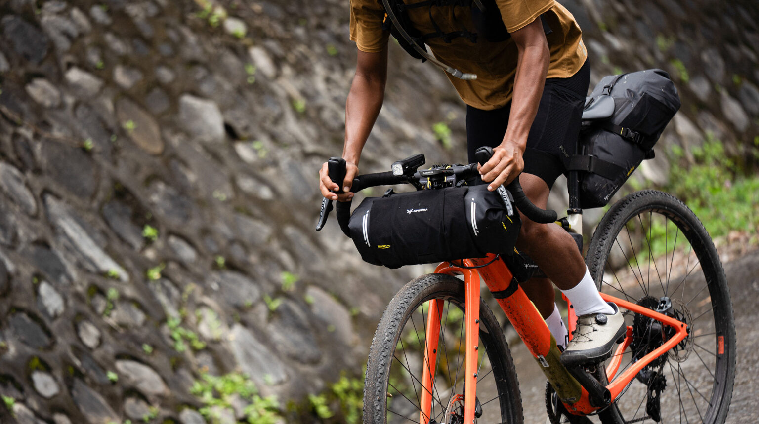 2026 apidura expedition series bikepacking frame bags shown on a gravel bike.