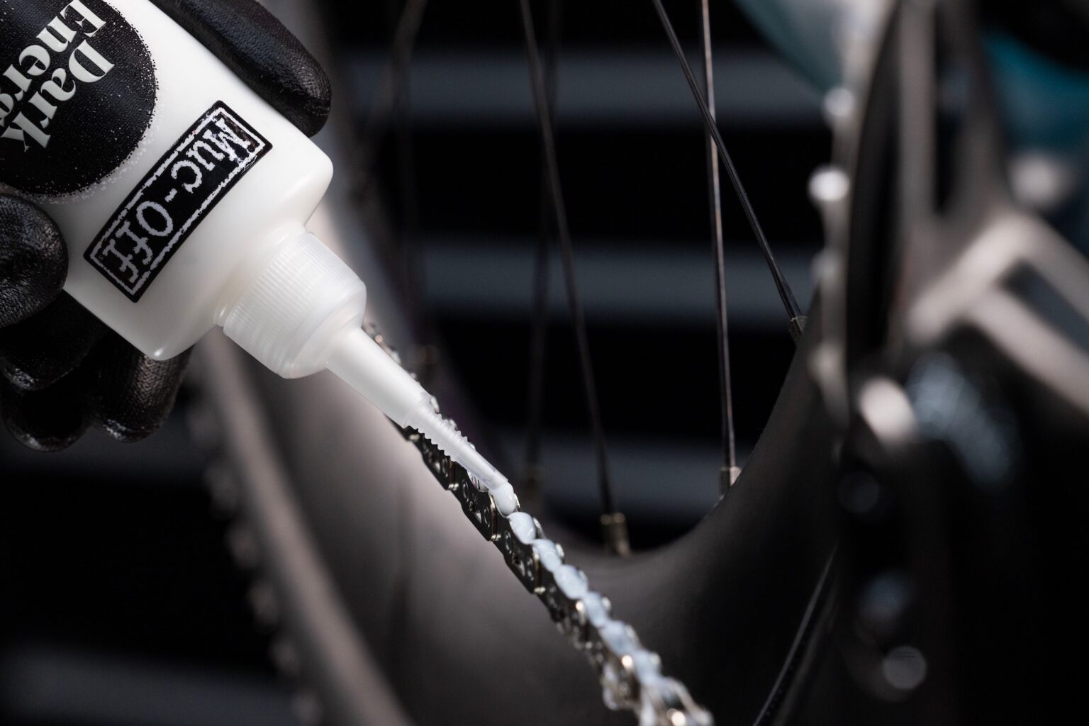 applying Dark Energy Chain Wax to a bike chain