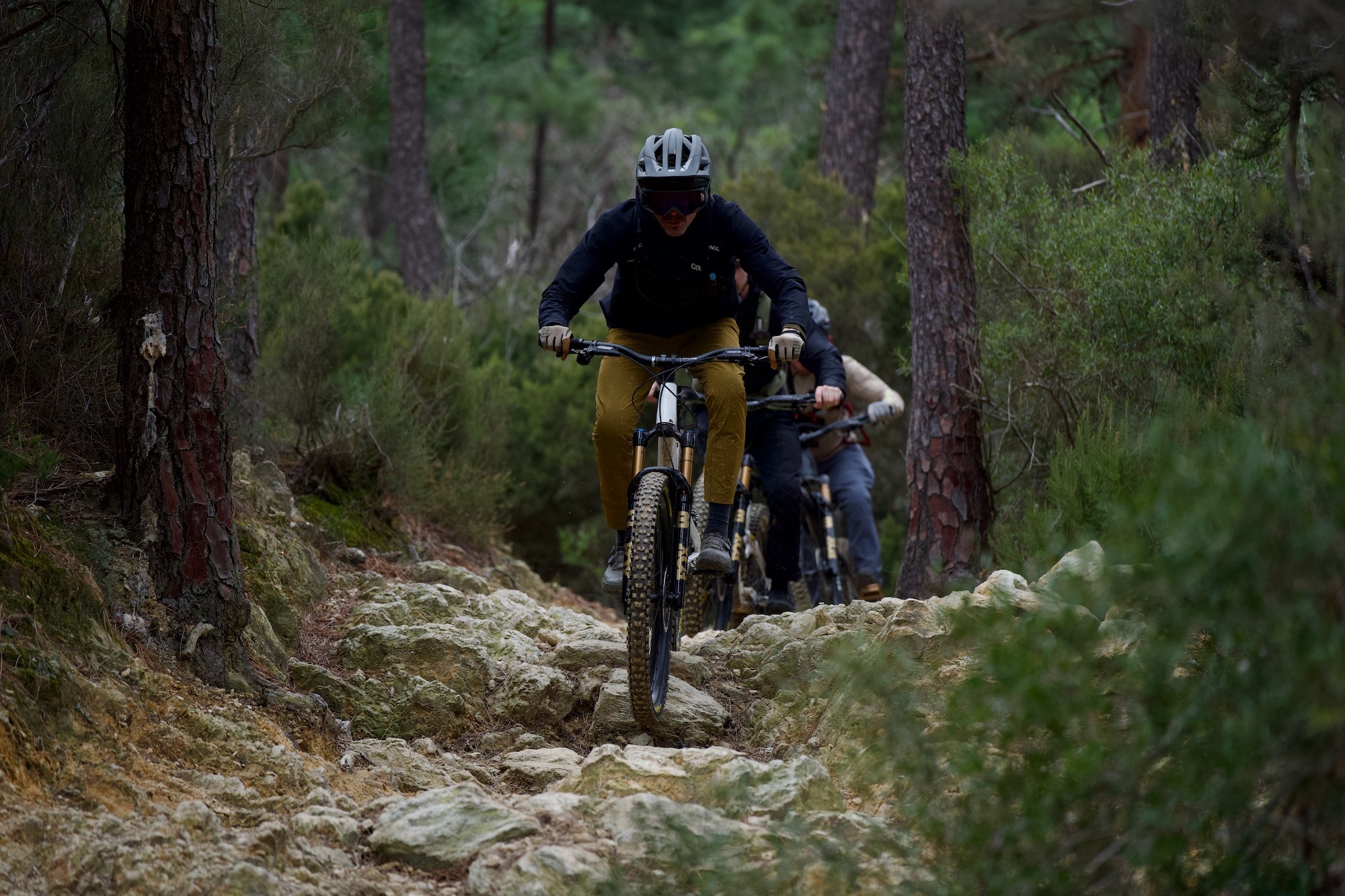 riding down a very rocky trail with the Fox 38 in Finale Ligure.