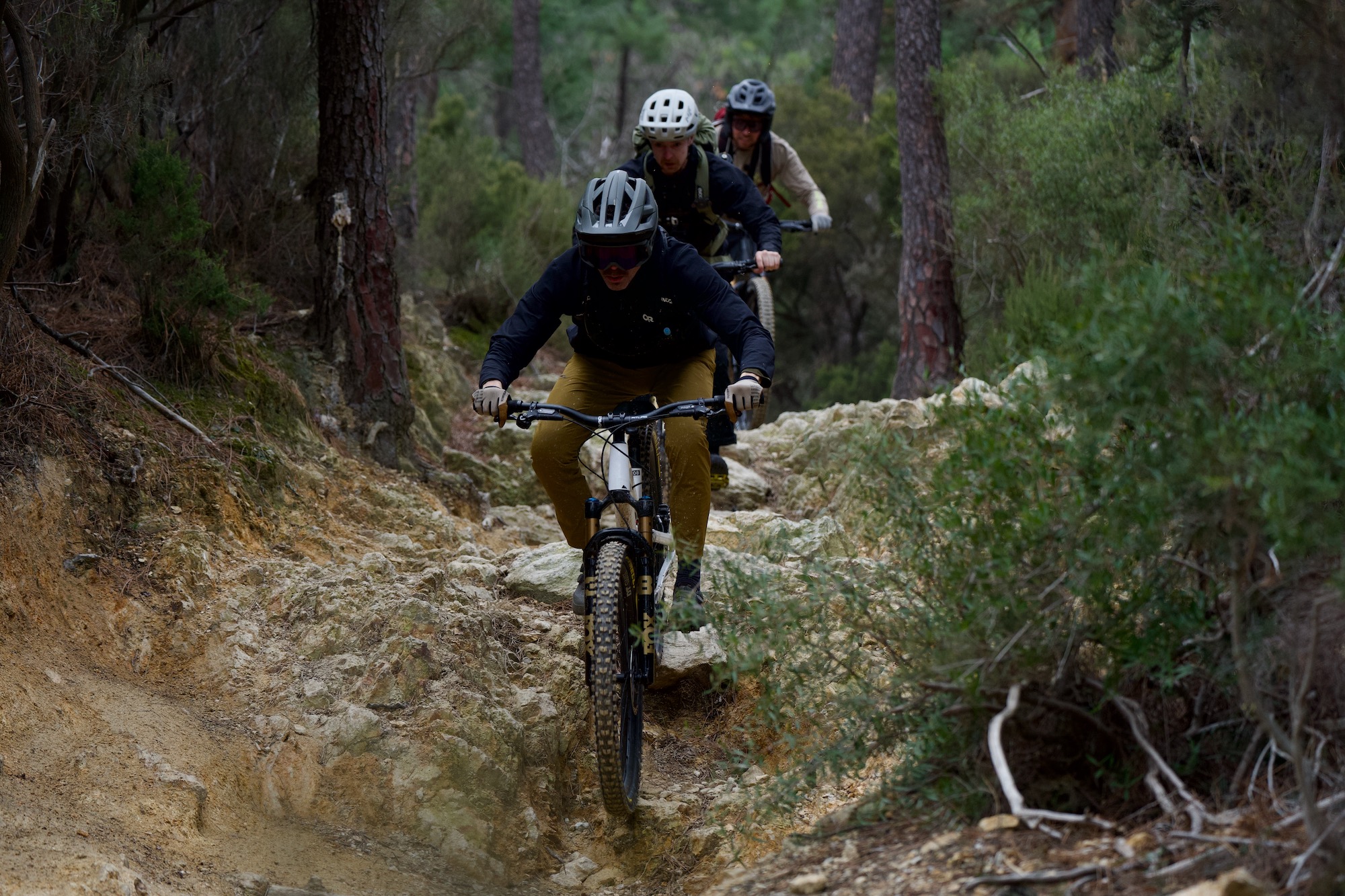 riding down a rocky trail in finale ligure while testing the Fox 38 fork.
