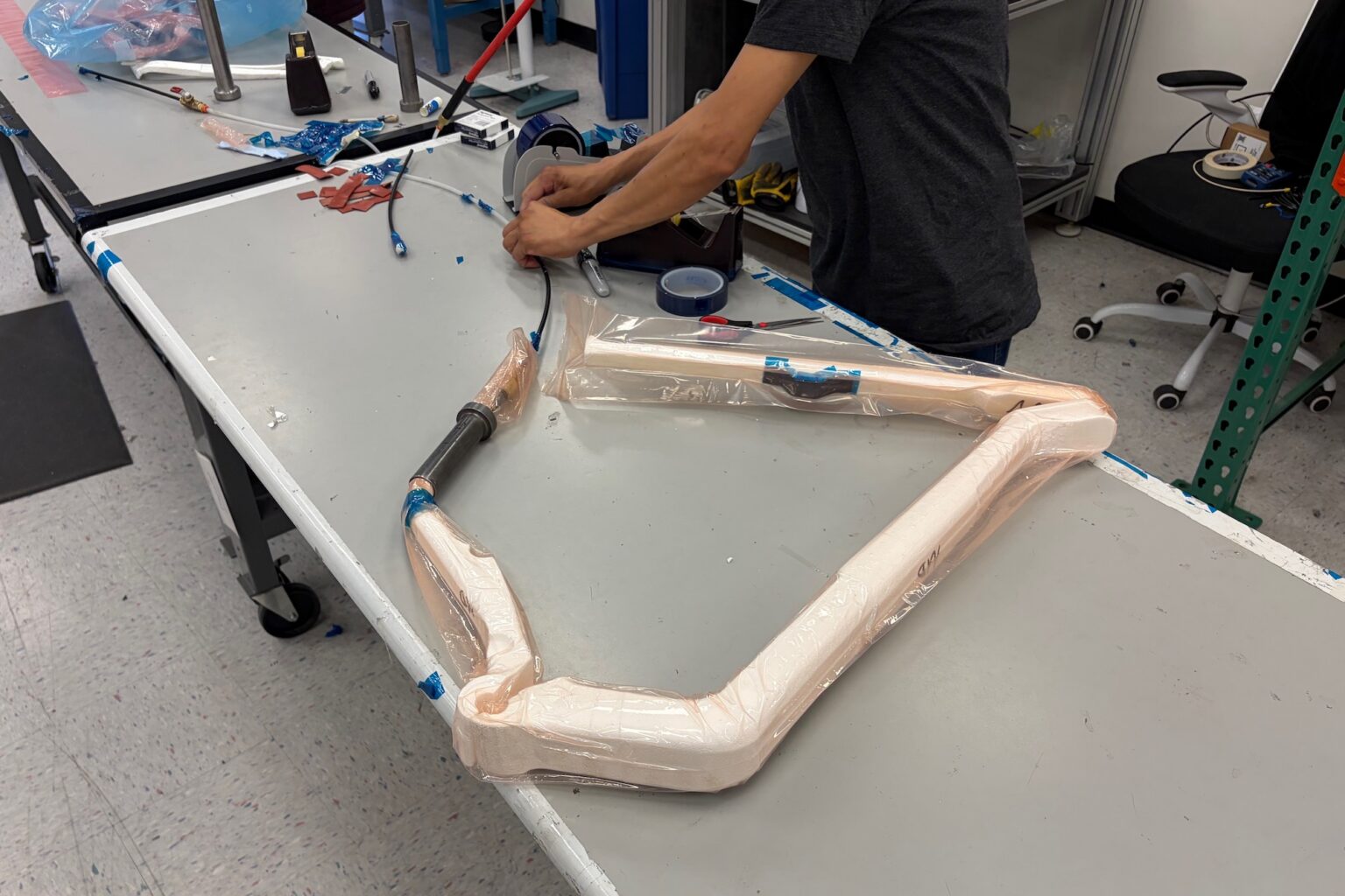 the styrofoam blanks being encased in the bladder before being laif up with carbon fiber pieces and put into the mold.