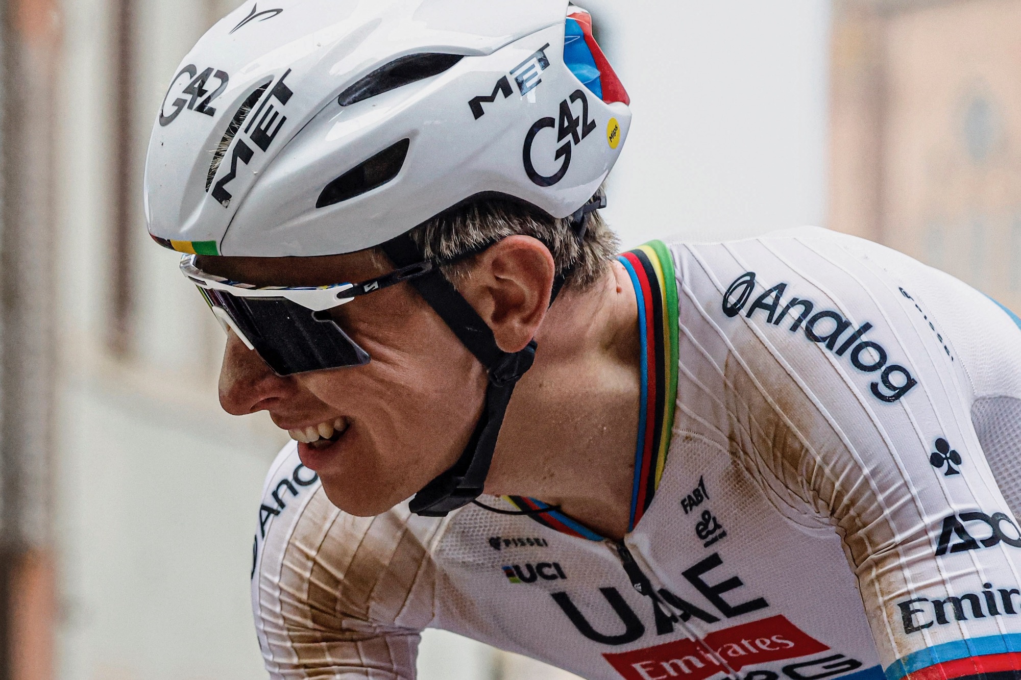 Tadej Pogacar wearing the Scicon Aeroshade 2.0 Titanium while riding at Strade Bianche