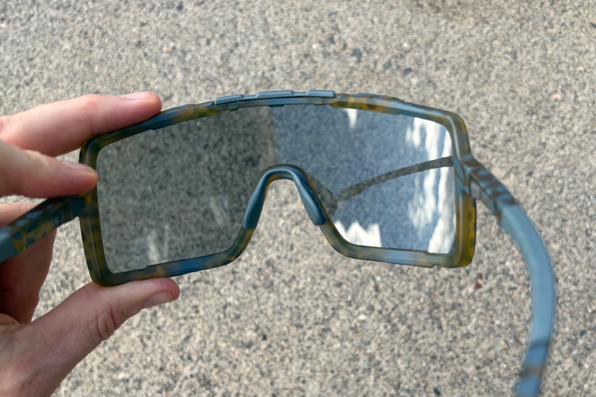 a look at the inside of the Smith Syncline sunglasses showing the inner lens, nose pad, and temples.