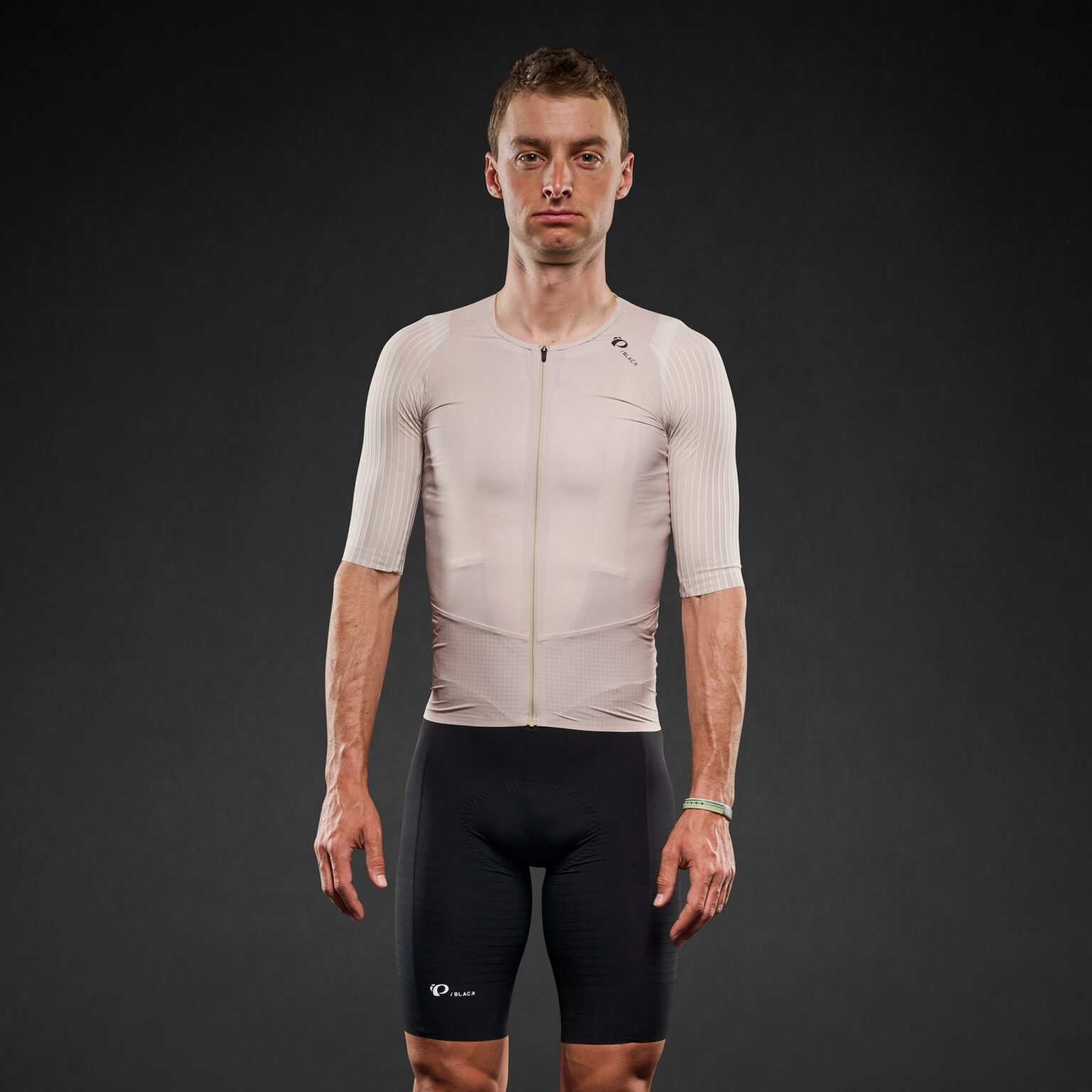 studio image of a man wearing the Pi Black jersey, from the front