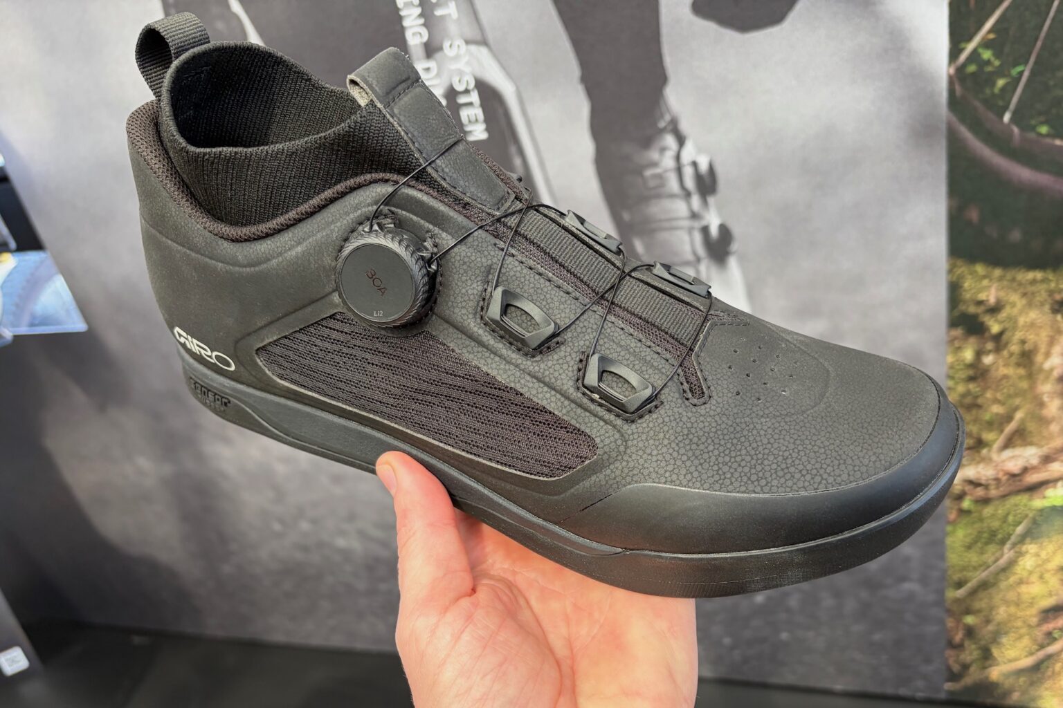 holding the new Giro Chamber Trail shoe at the Sea Otter Classic