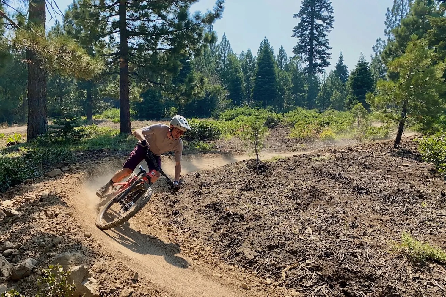 riding around a berm while testing the Sweet Protection Bushwhacker 2Vi MIPS helmet.