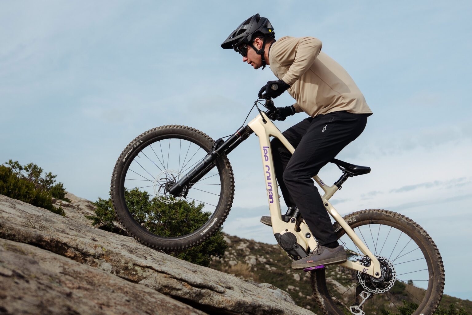 a ride going up a steep climb on the Lee Cougan Flö eMTB.