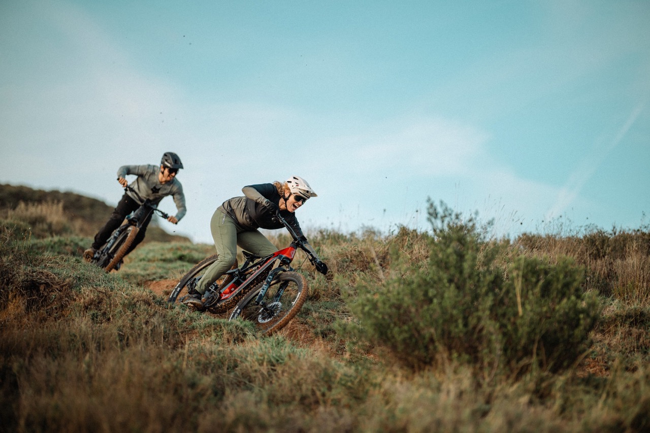 two rider on the new Cannondale Moterra riding down a trail