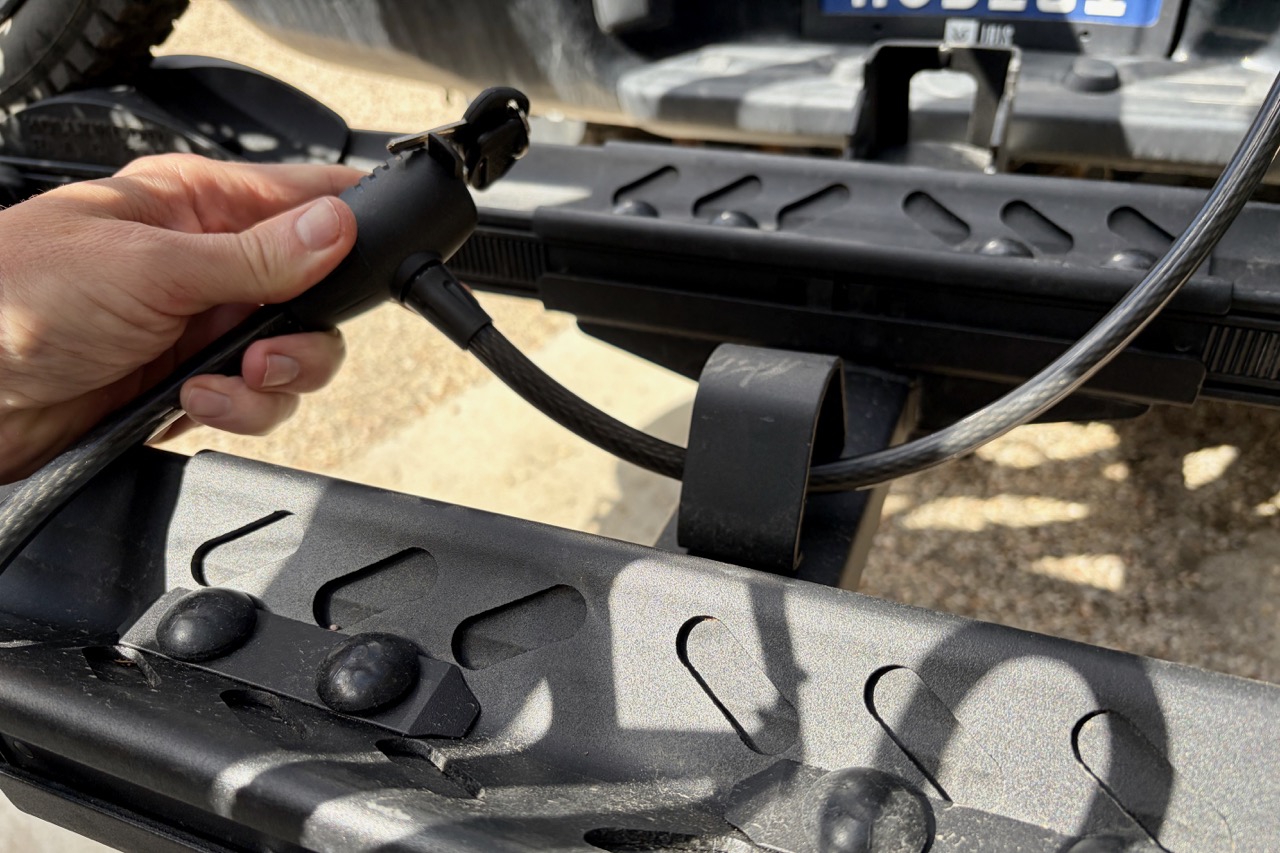 locking the cable lock through the lock loop on the Hollywood Crosstrack rack.