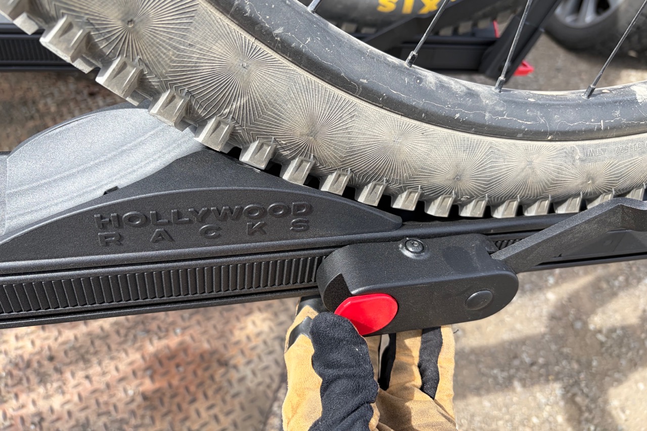 the wheel arm release button and the wheel chock on the Hollywood Racks CrossTrack