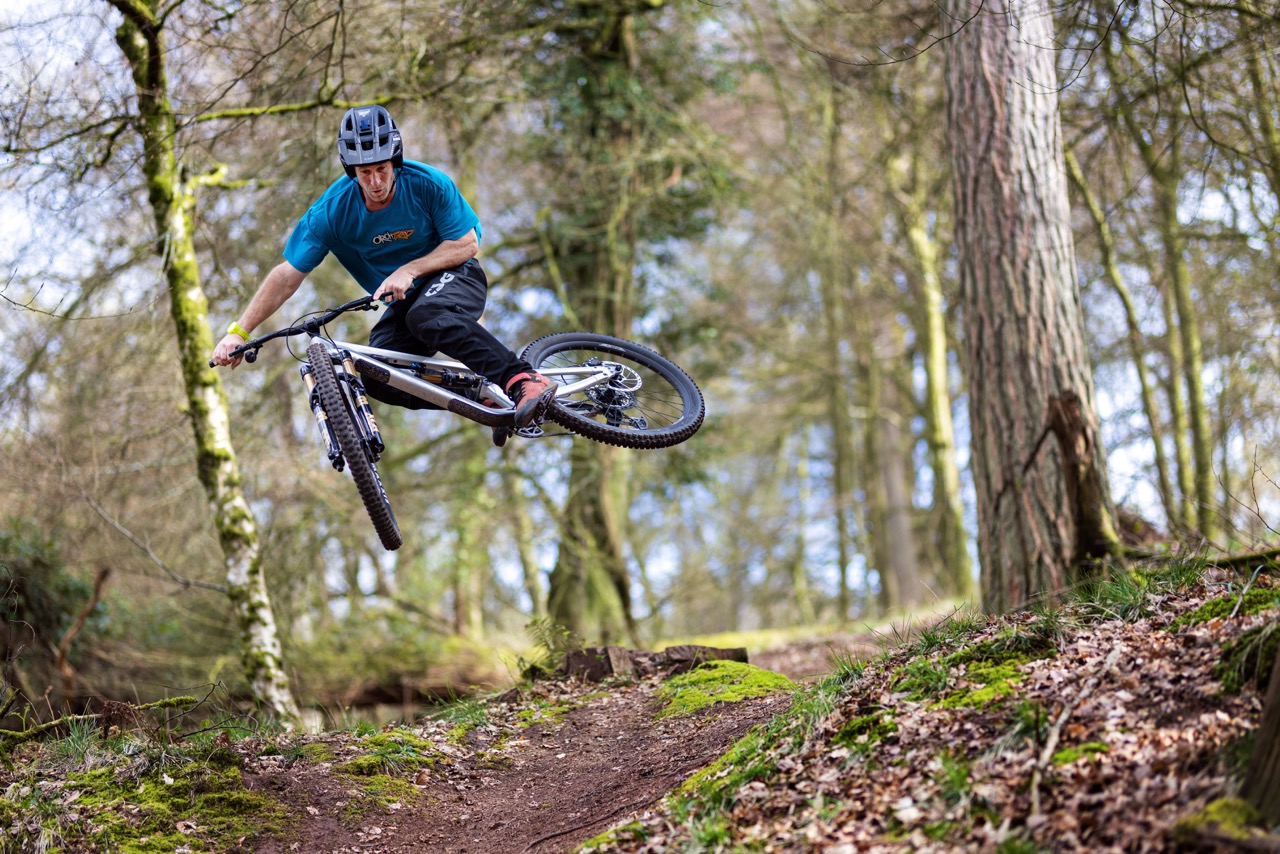 a man hitting a jump while riding the Canyon Torque AL
