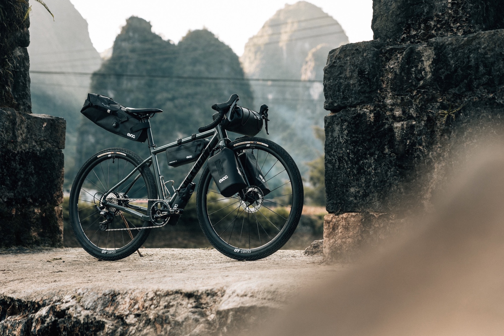 a bike loaded up with a variety of EVOC bikepacking bags