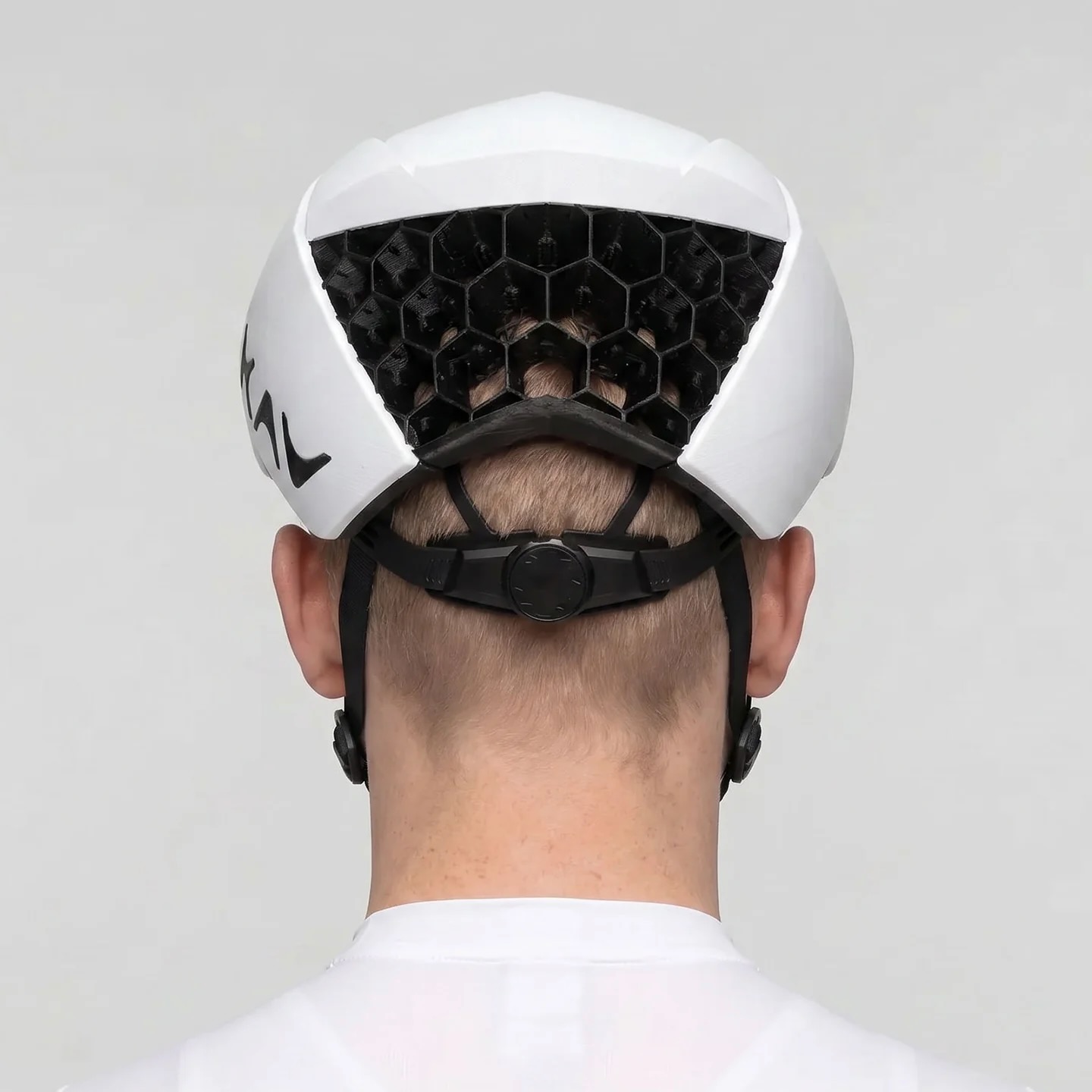 studio image of a man wearing the KAV Silvo in white, viewed from the rear