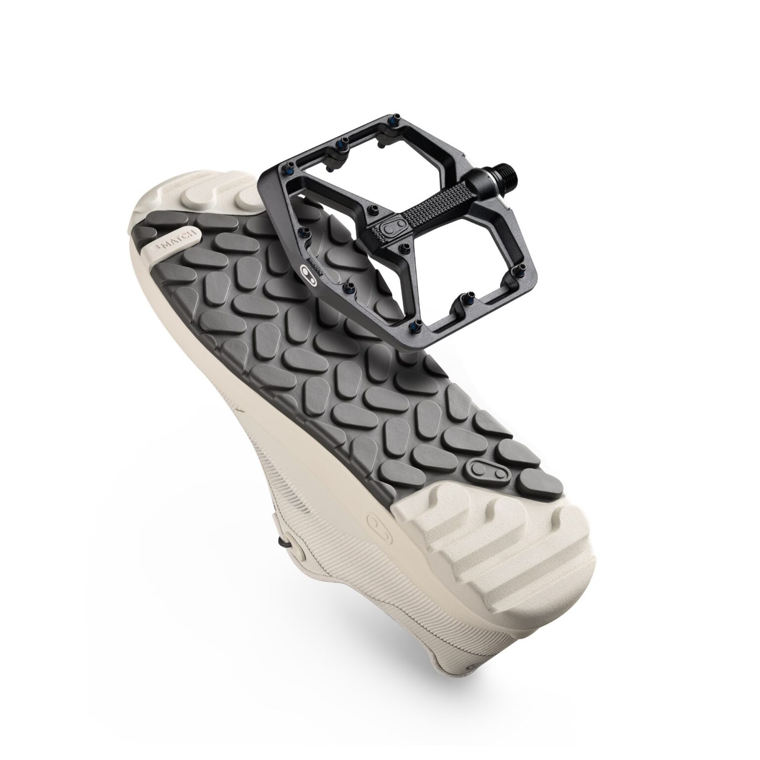 studio image of the sole of the Crankbrothers Stamp Trail Vent shoe with a Stamp pedal
