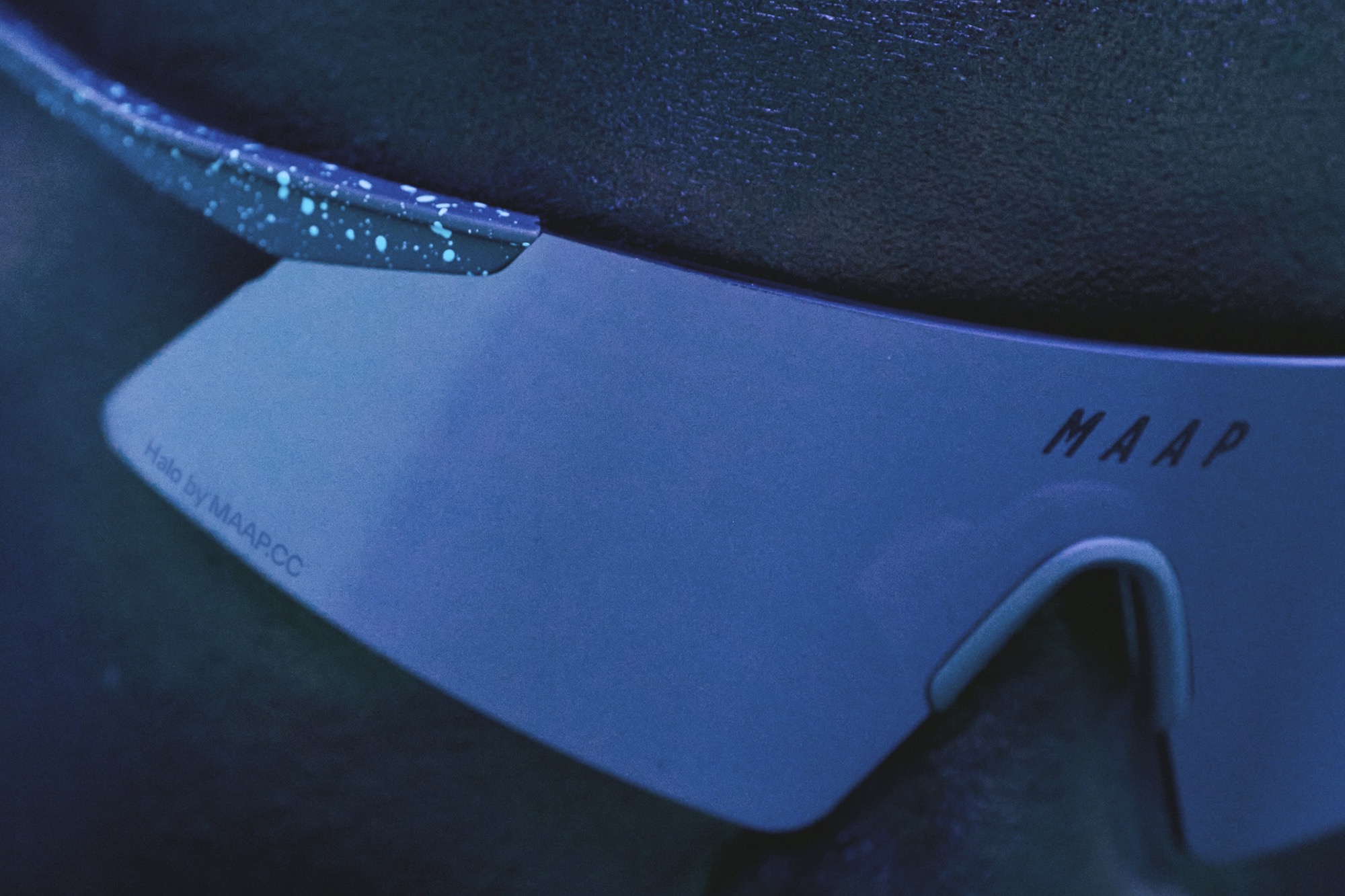 close up image of a person wearing the MAAP Halo sunglasses.