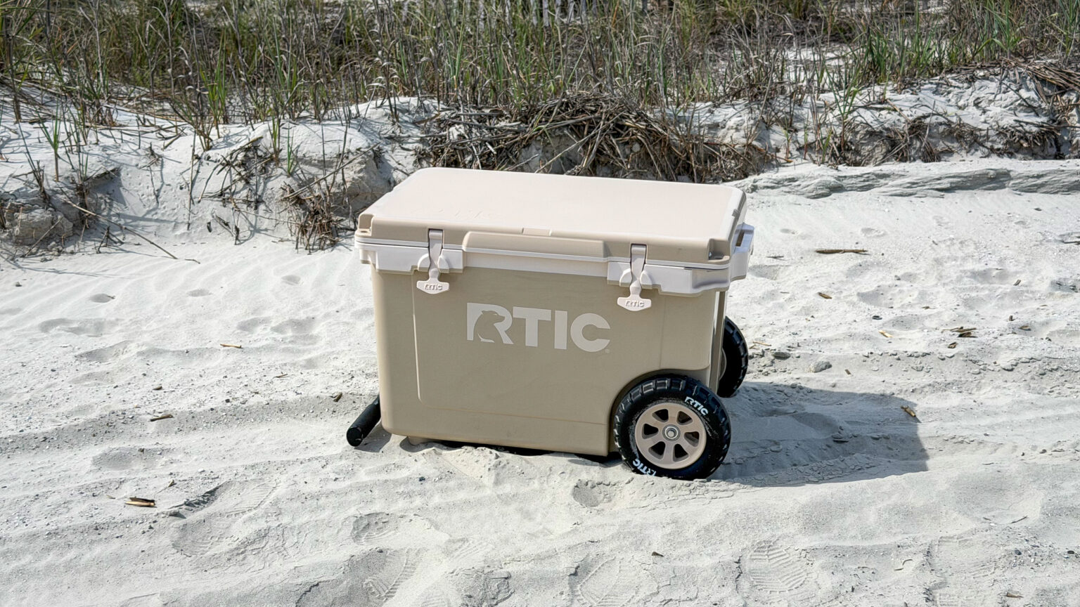 RTIC 54 qt wheeled cooler on sand