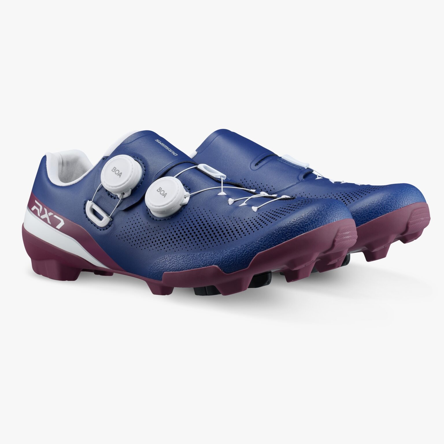 studio image of the pair of Shimano RX710 gravel shoes in navy, viewed from the front angle
