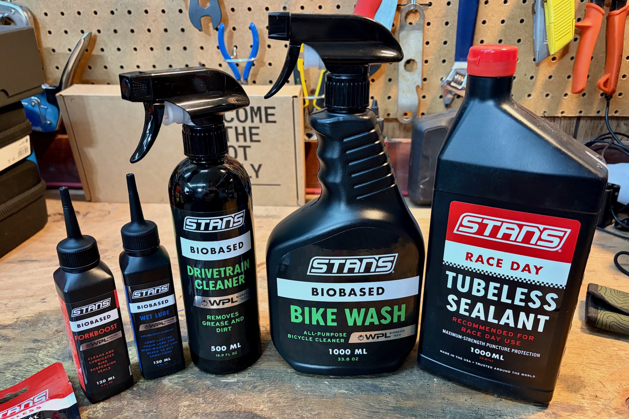 several of the Stan's Biobased cleaning and lube product on a workbench