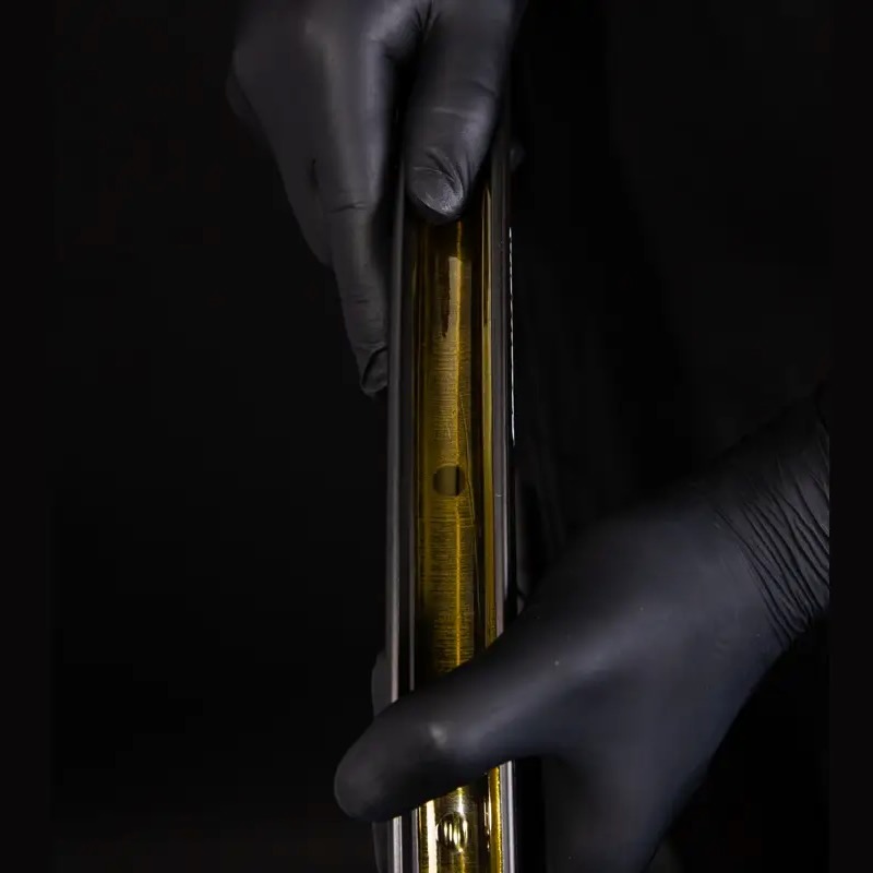 studio image of a person installing absoluteBLACK tubeless tape
