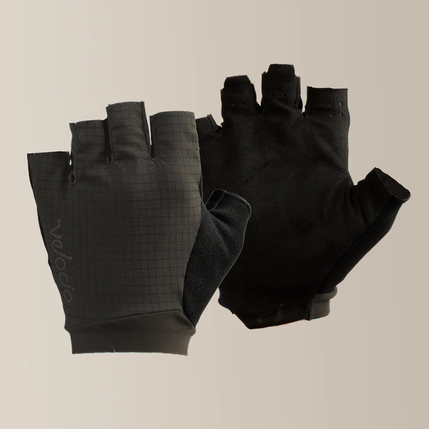 studio image of the Velocio LUXE Ultralight gloves in Black Olive