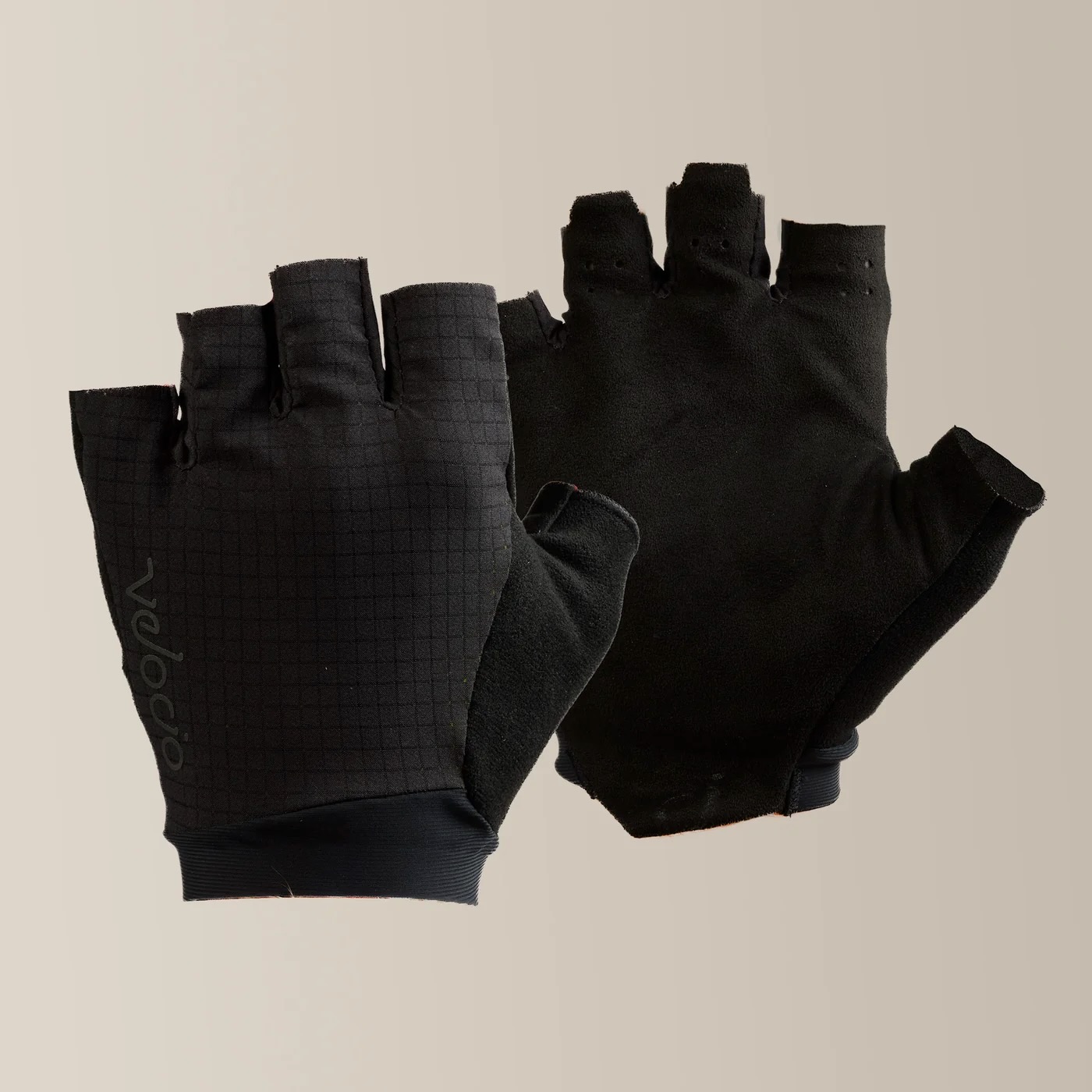 studio image of the Velocio LUXE Ultralight gloves in Black