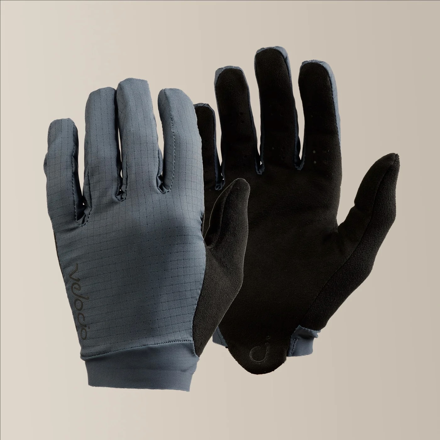 studio image of the Velocio TRAIL Ultralight gloves in Charcoal