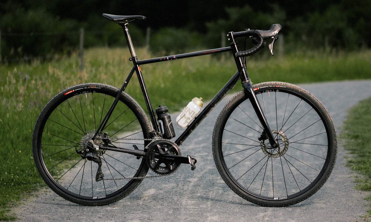 all-new DT Swiss 1800-series affordable alloy dropbar bike wheels: on a steel gravel bike
