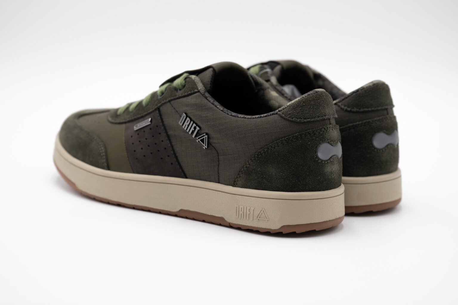 studio image of a pair of Drift Minna shoes in Army green