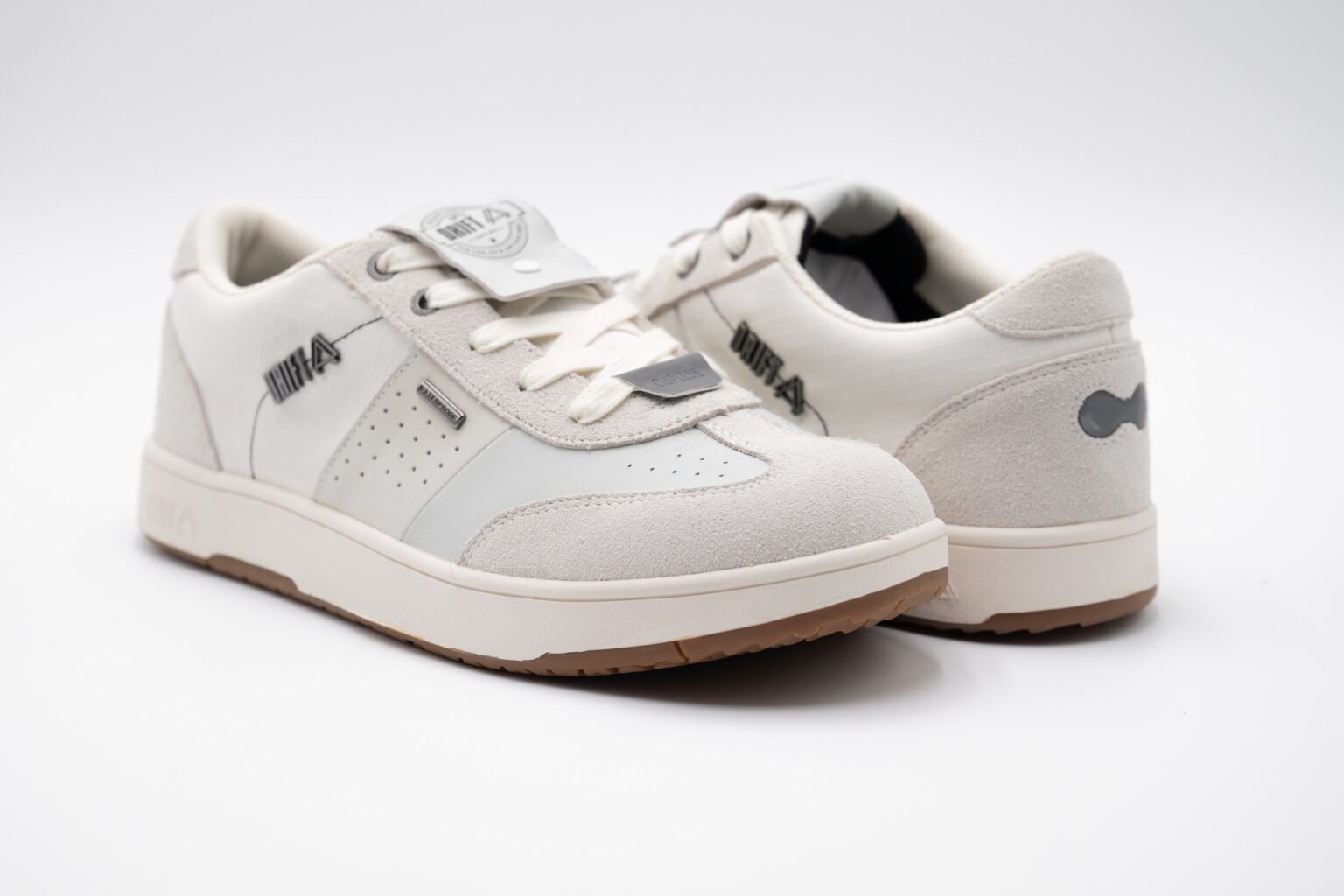 studio image of a pair of Drift Minna shoes in bone white