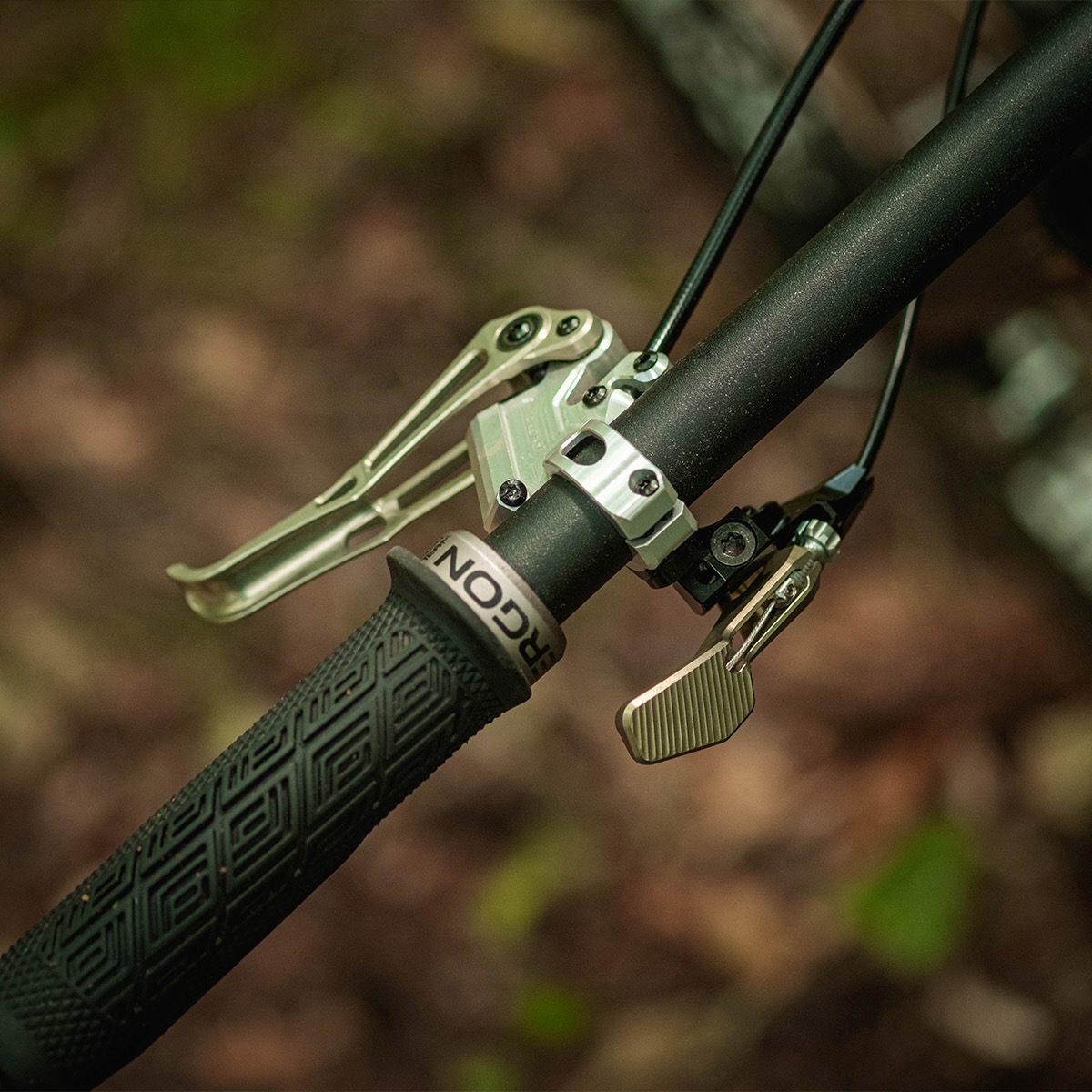 The Intend Elevator Boy dropper remote mounted on the handlebar of a mountain bike.