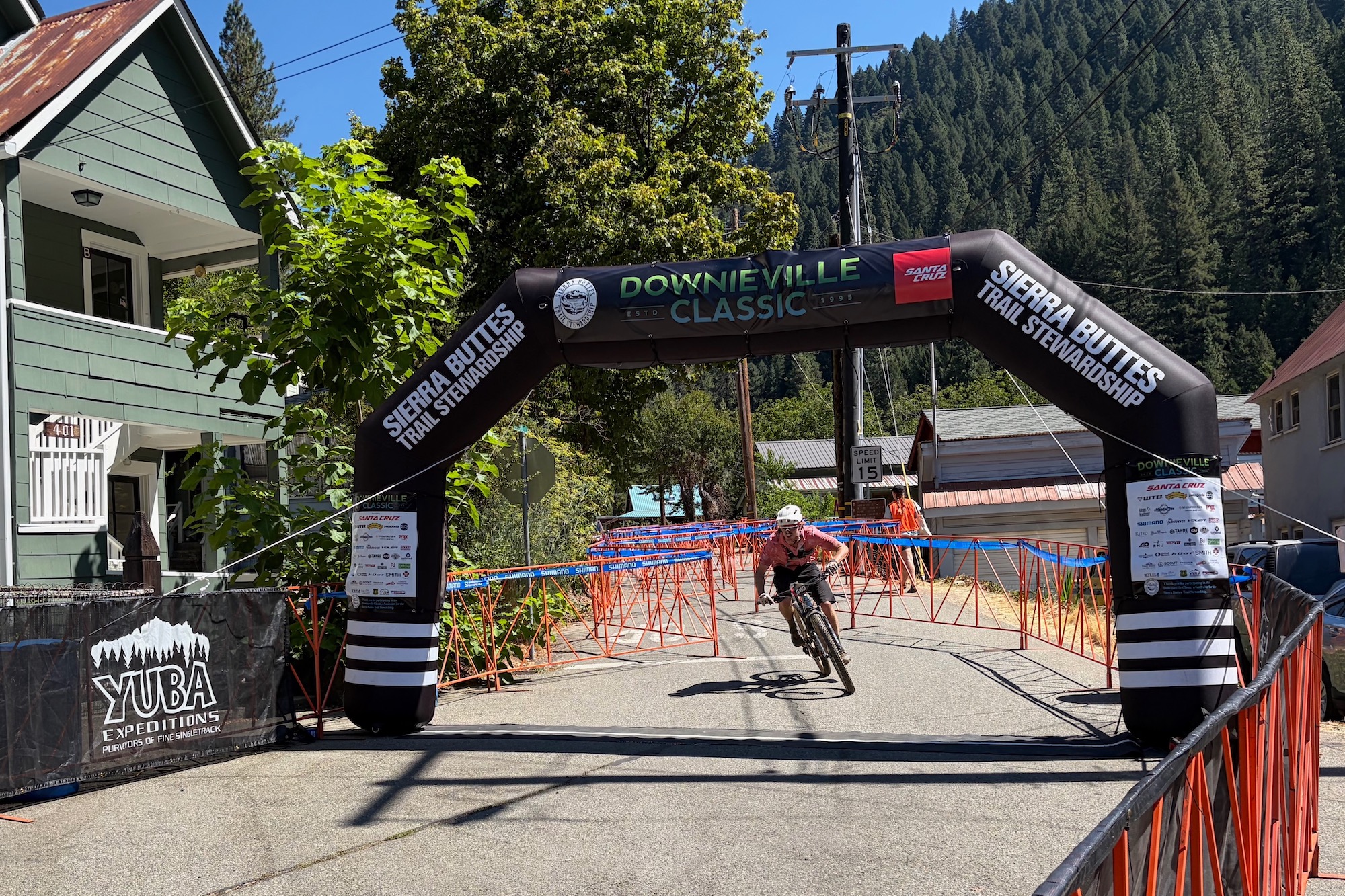 a racer crossing the finish line in Downieville