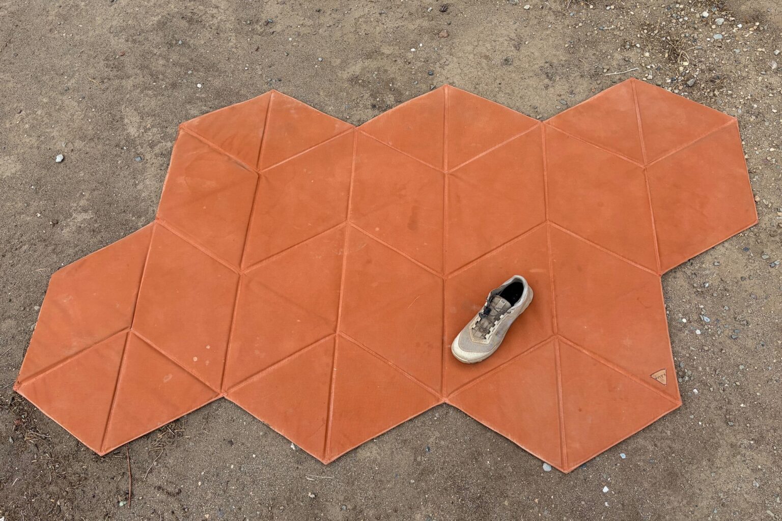 the unfolded kama mat wit a shoe for scale