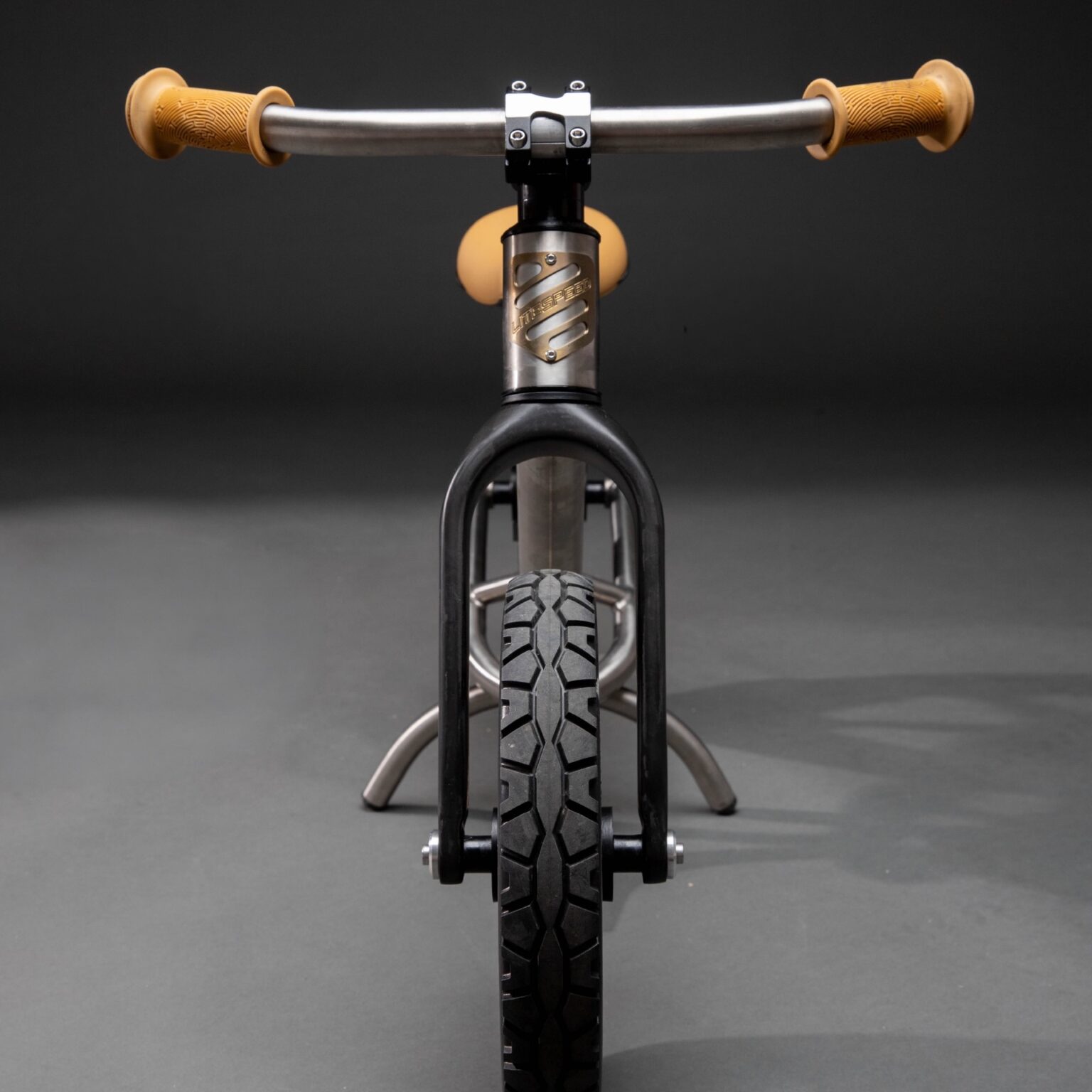 studio image of the Litespeed Rumpus balance bike from the front